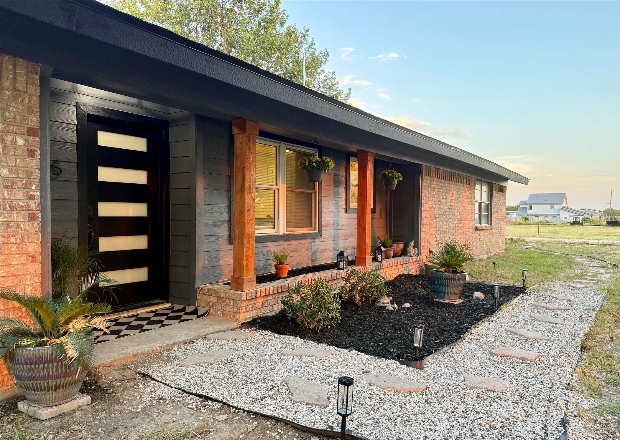 Brick and siding exterior with a dark fascia