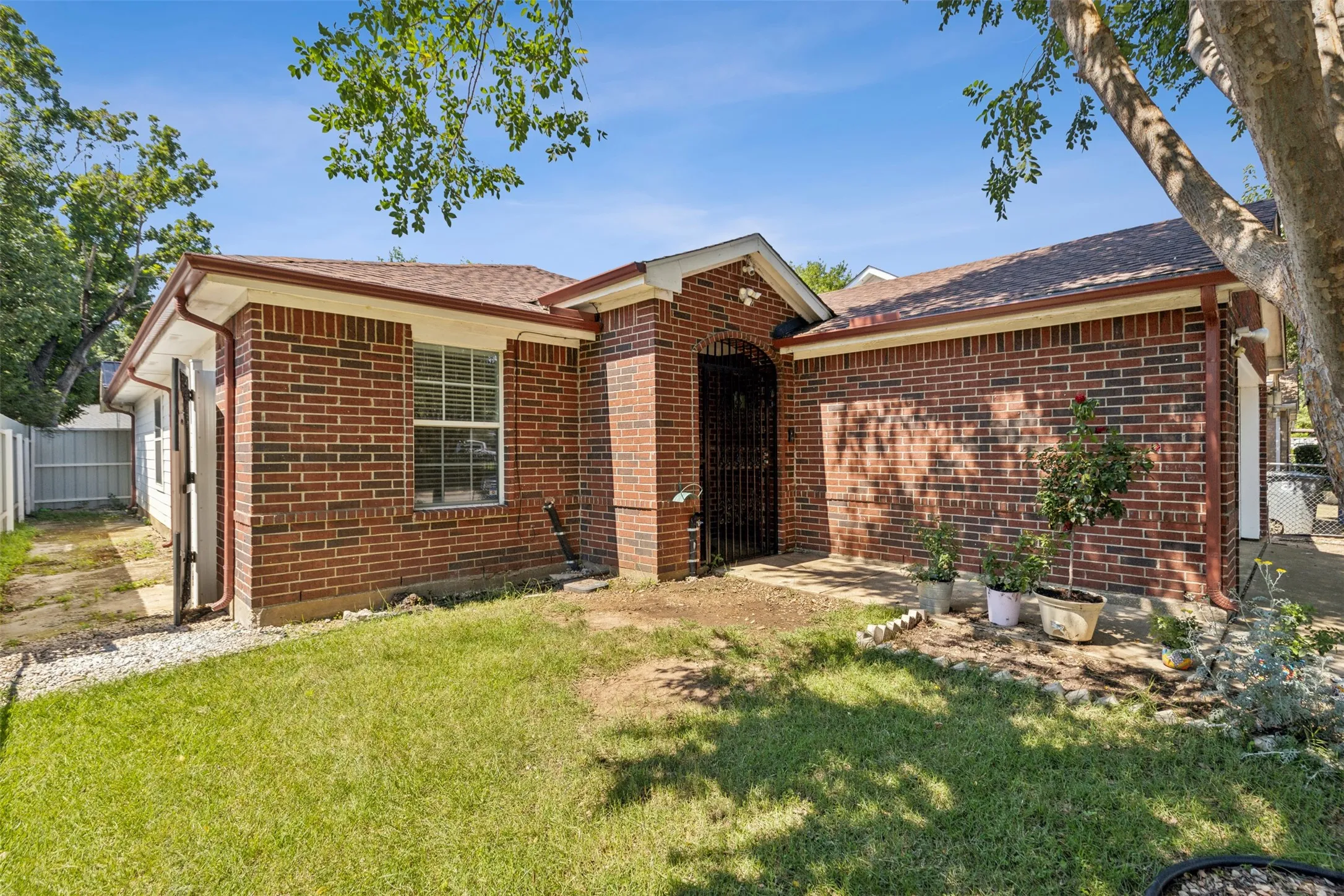 Ranch-style home featuring a front lawn