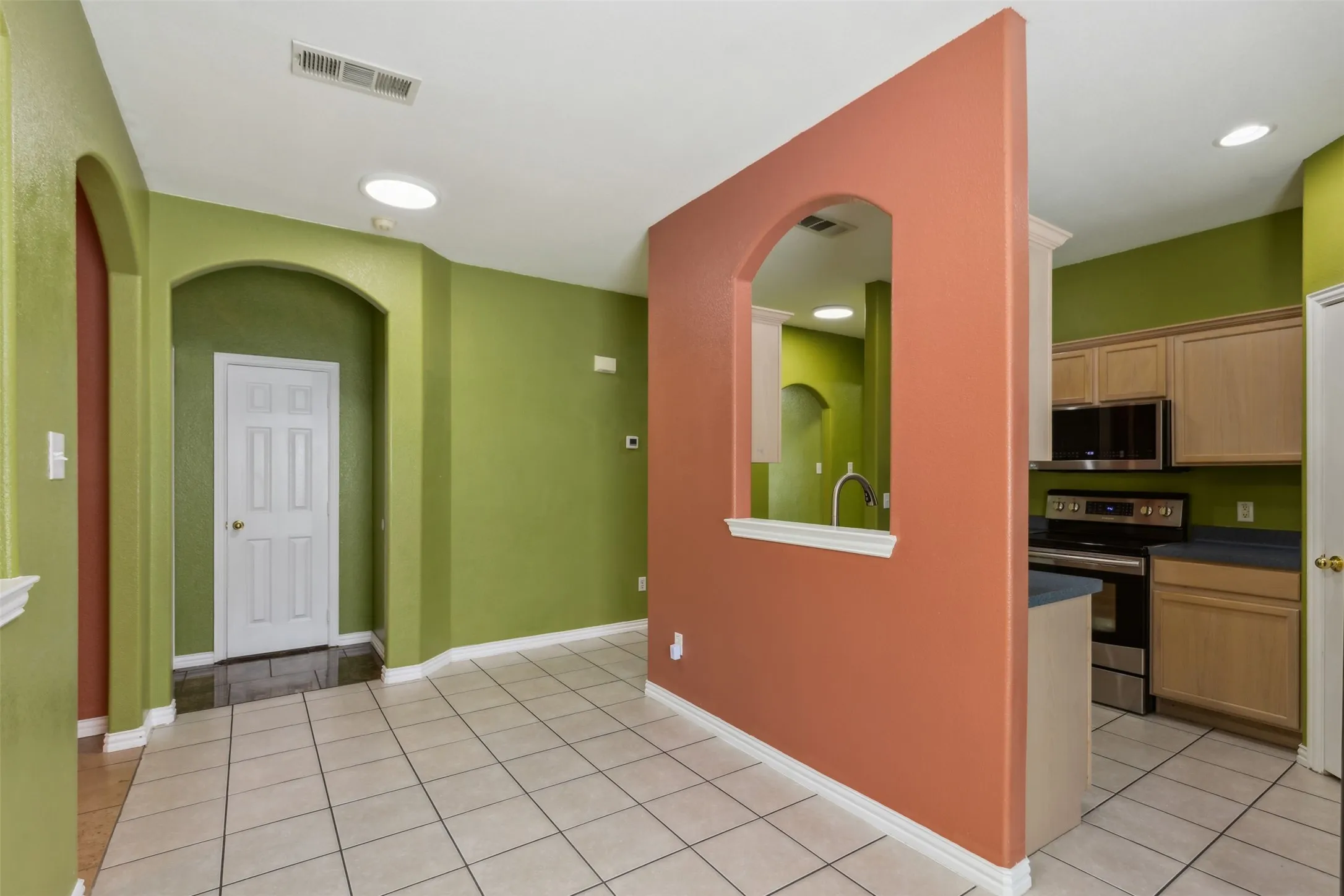 Foyer entrance with light tile flooring