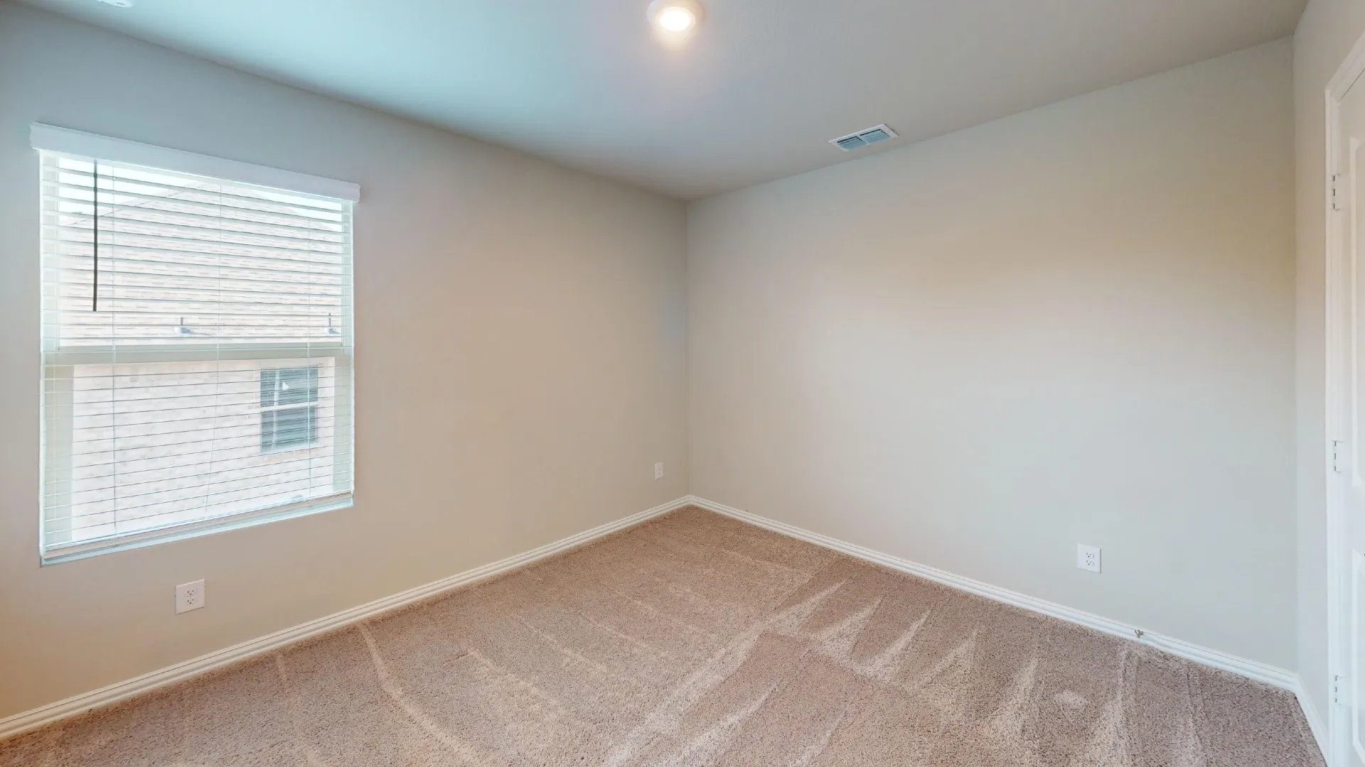 Window with horizontal blinds, neutral wall paint, and plush carpet flooring