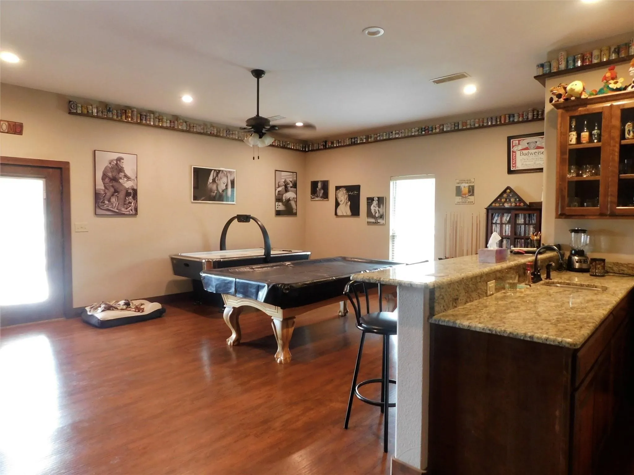 Game Room with entry and Pool & Hockey tables stay. Wet Bar and half bath room