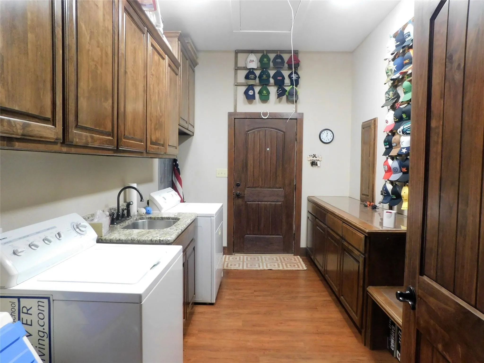 Large utility with sink and folding counter with plenty of storage.