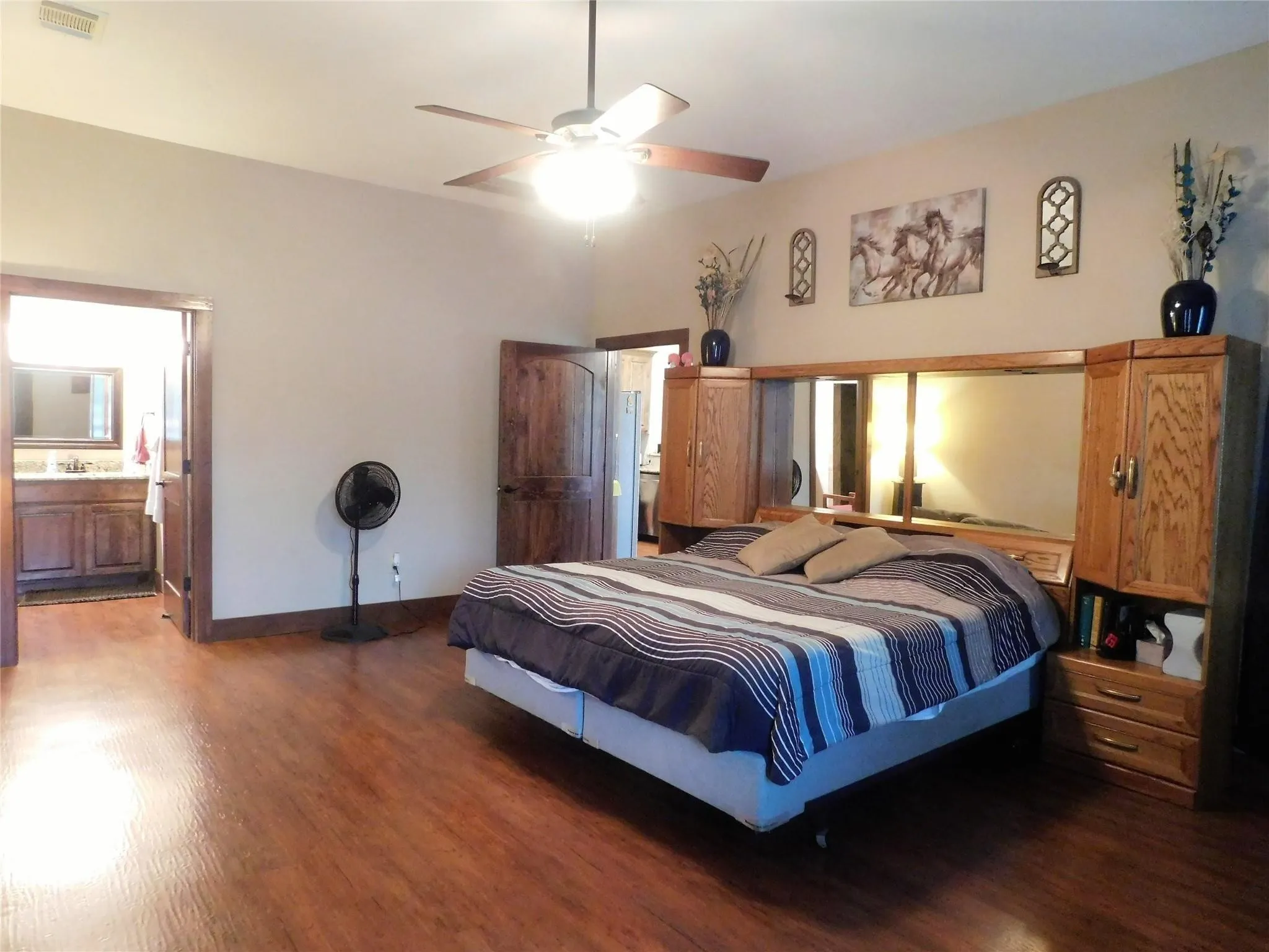 King-Size and Beyond! An oversized primary bedroom that easily handles a king bed and a full sitting area.
