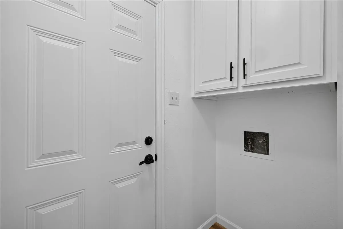White paneled door with matte black hardware