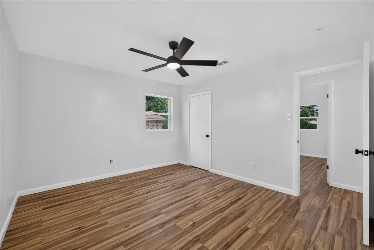 Light-toned walls complement wood-finish flooring