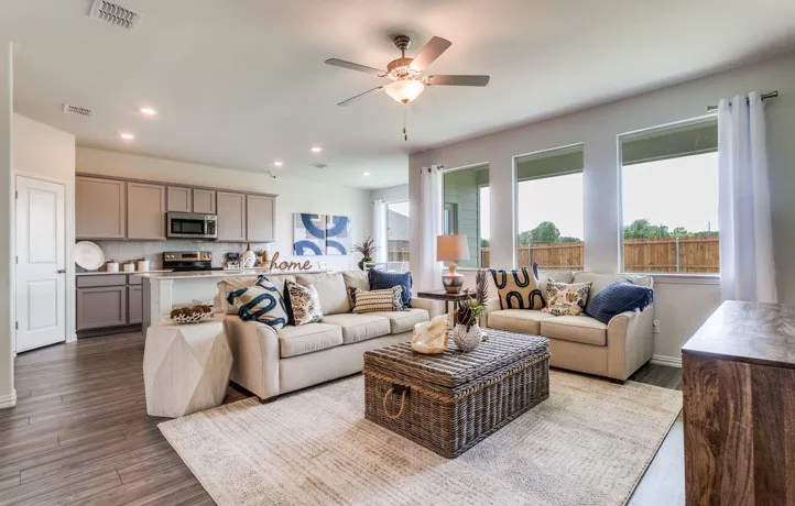 Open-concept living space featuring wood-finish flooring, recessed lighting, and a ceiling fan