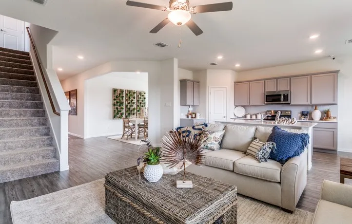 Open concept living area featuring wood-finish flooring, recessed lighting, and a ceiling fan