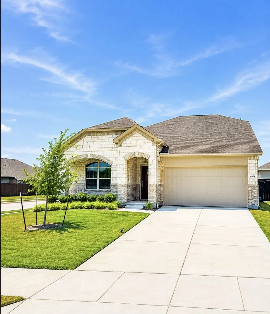 Stone exterior with brick accents, arched entry, single-car garage, and established landscaping