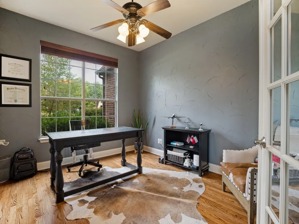 Dedicated first-floor home office with French doors, wood flooring and abundant natural light—ideal for working from home or a private study.