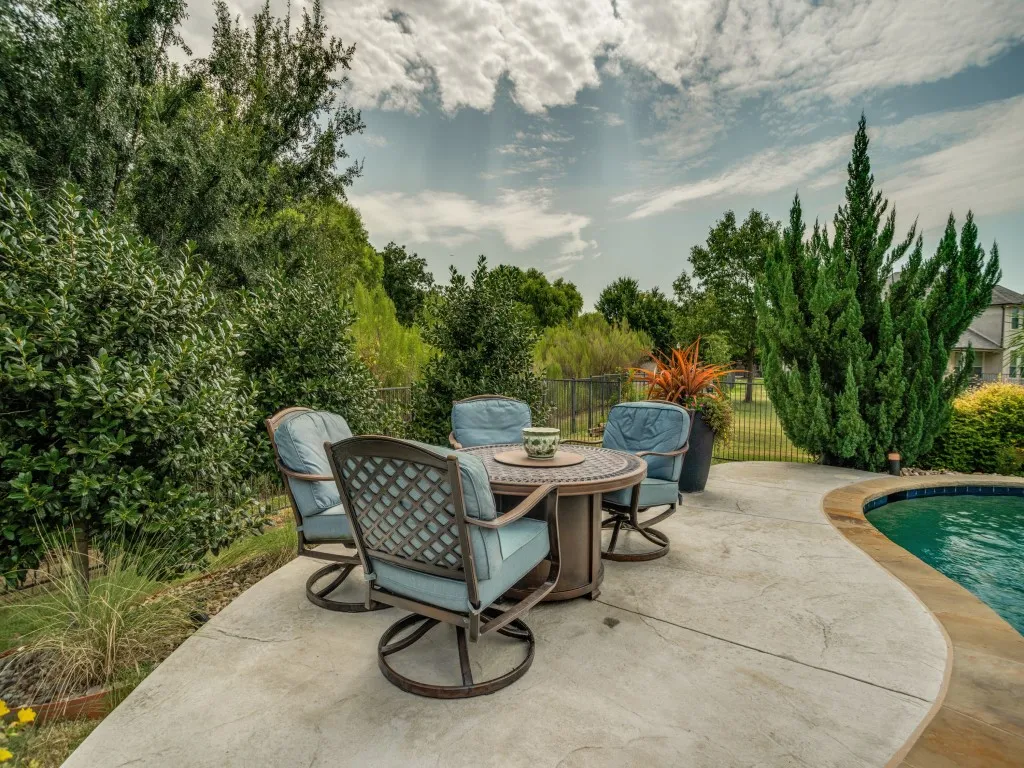 Multiple poolside seating areas and mature landscaping create a private outdoor oasis designed for relaxing, entertaining and enjoying the Texas outdoors.