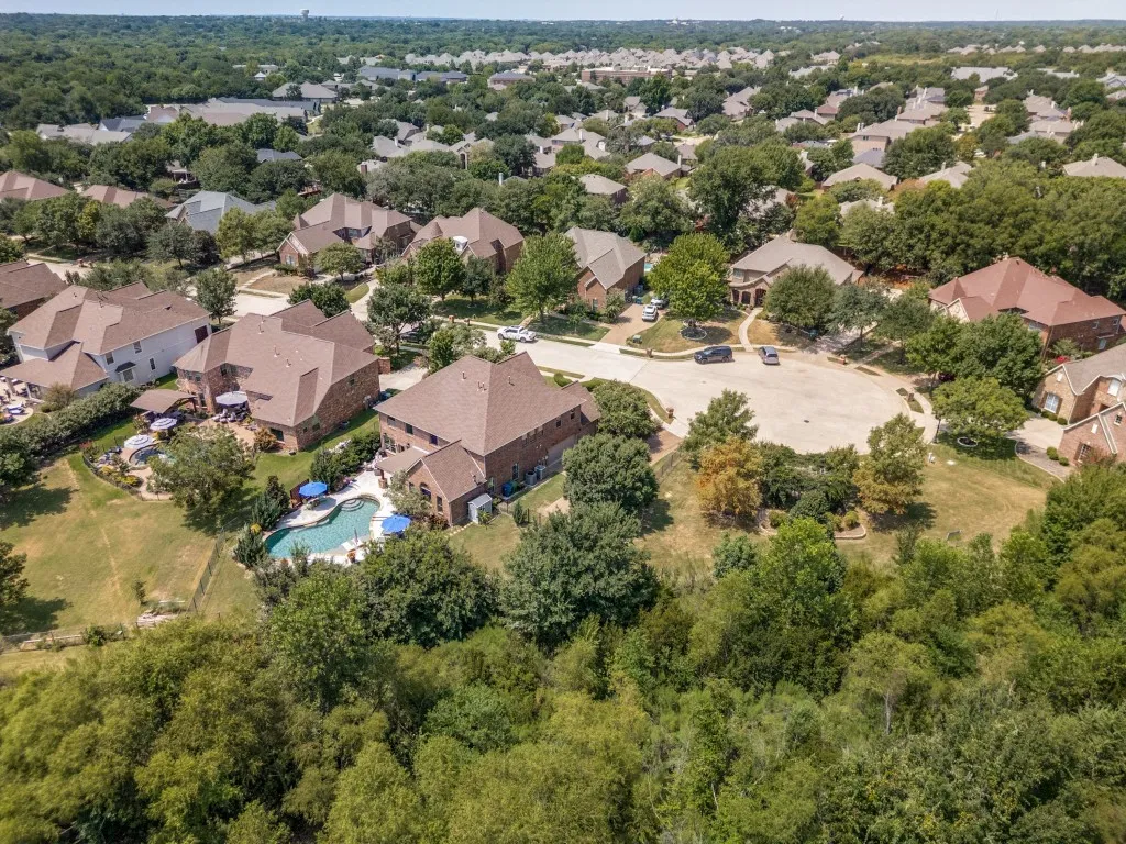 Exceptional cul-de-sac location backing to a wooded protected greenbelt, showcasing the privacy and natural surroundings that make this Flower Mound property truly special.