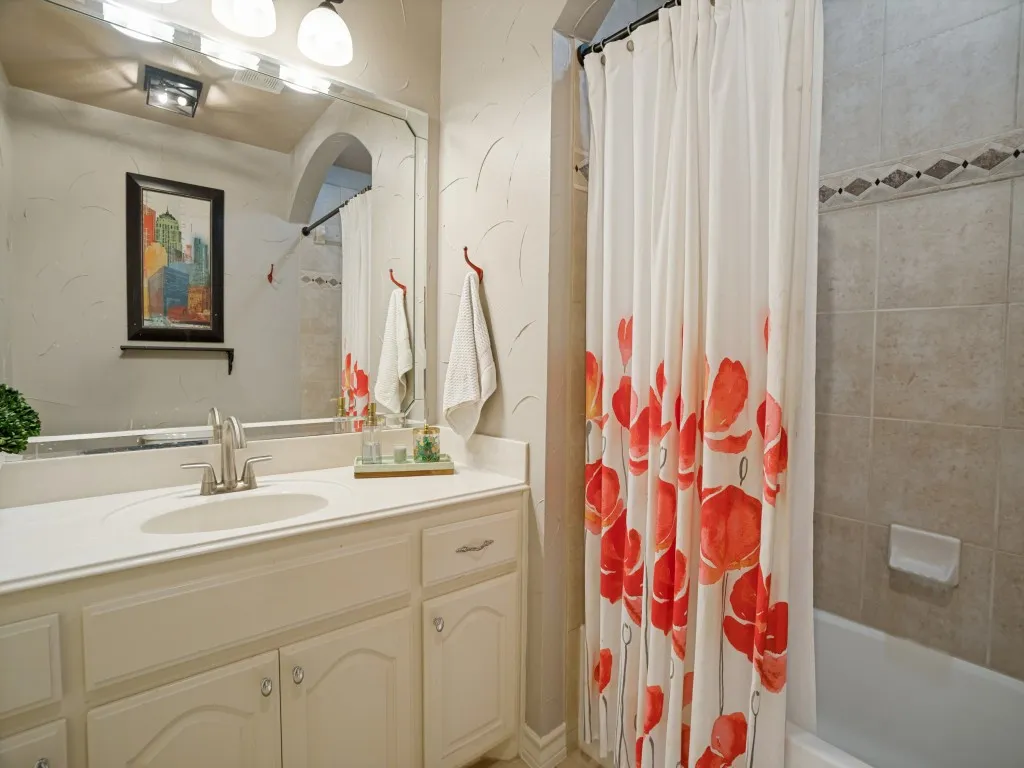 Private ensuite bath serving the split secondary bedroom, providing added privacy and convenience for guests.