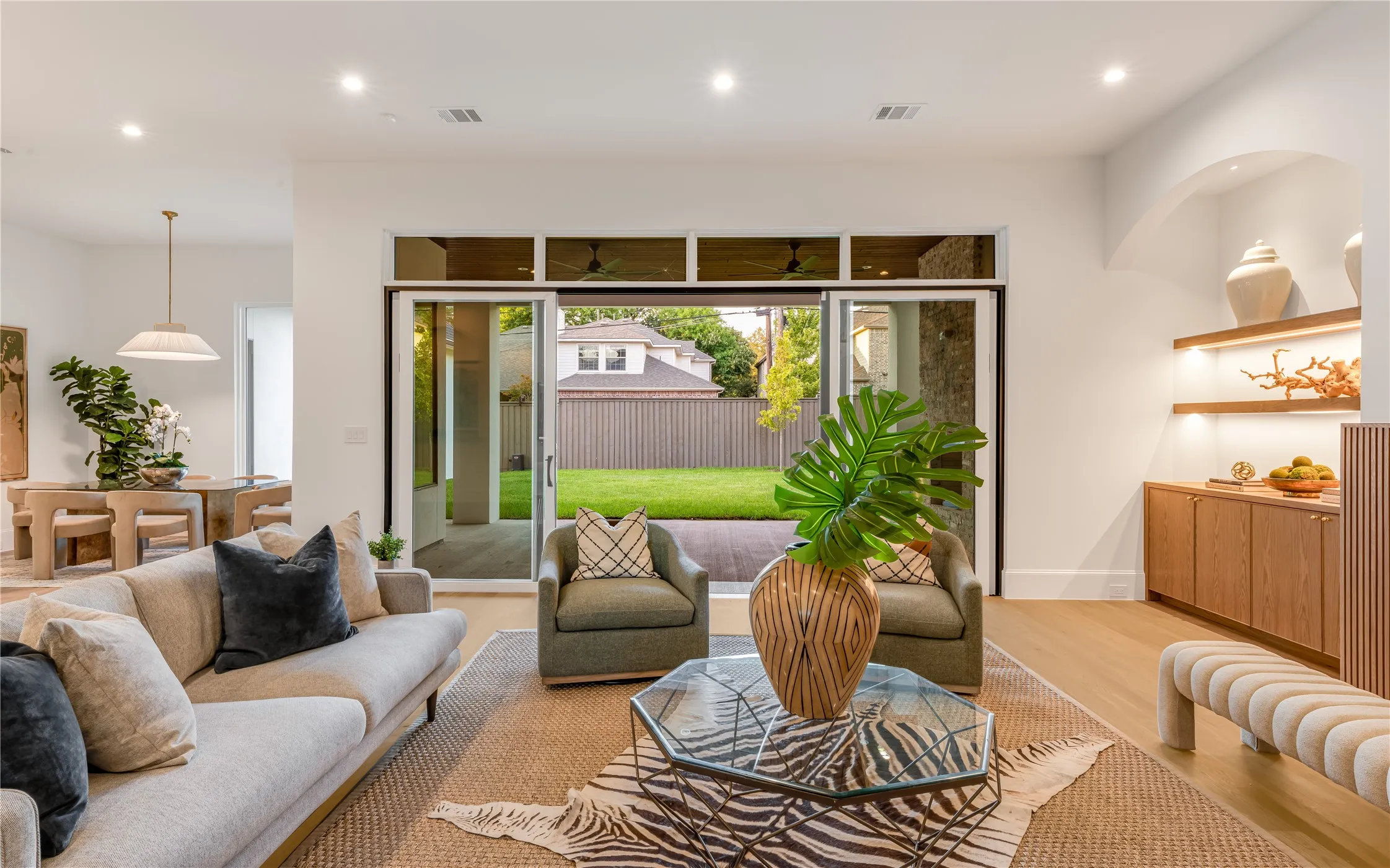 Open-concept living space with light-tone wood-finish​​‌​​​​‌​​‌‌​‌‌​​​‌‌​‌​‌​‌​​​‌​​ flooring
