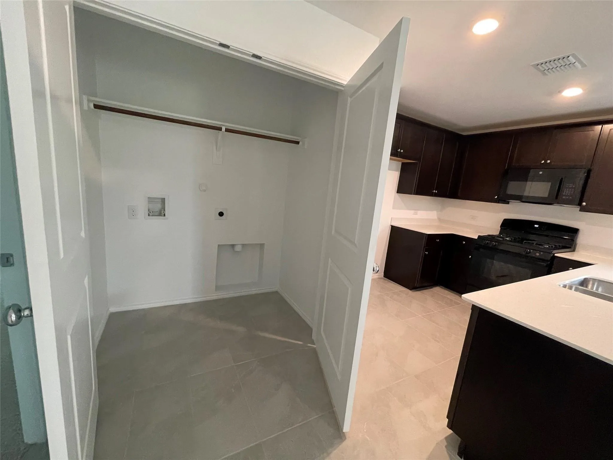 Dedicated laundry closet with shelving