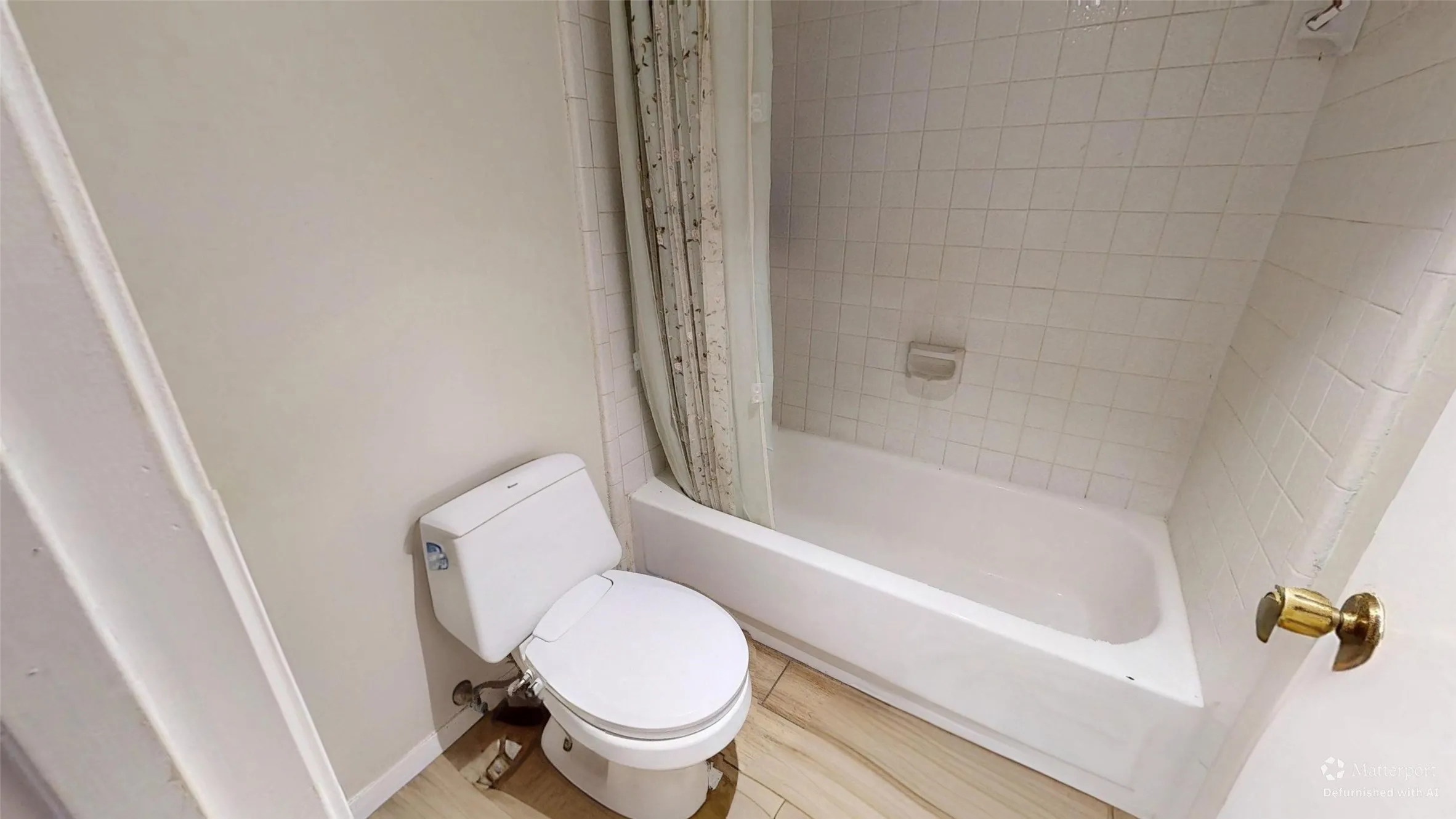 White ceramic toilet with exposed plumbing