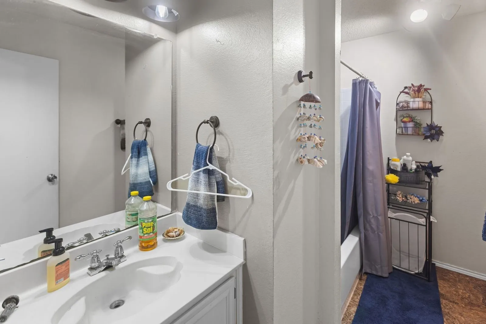 White vanity with an integrated sink and chrome faucet
