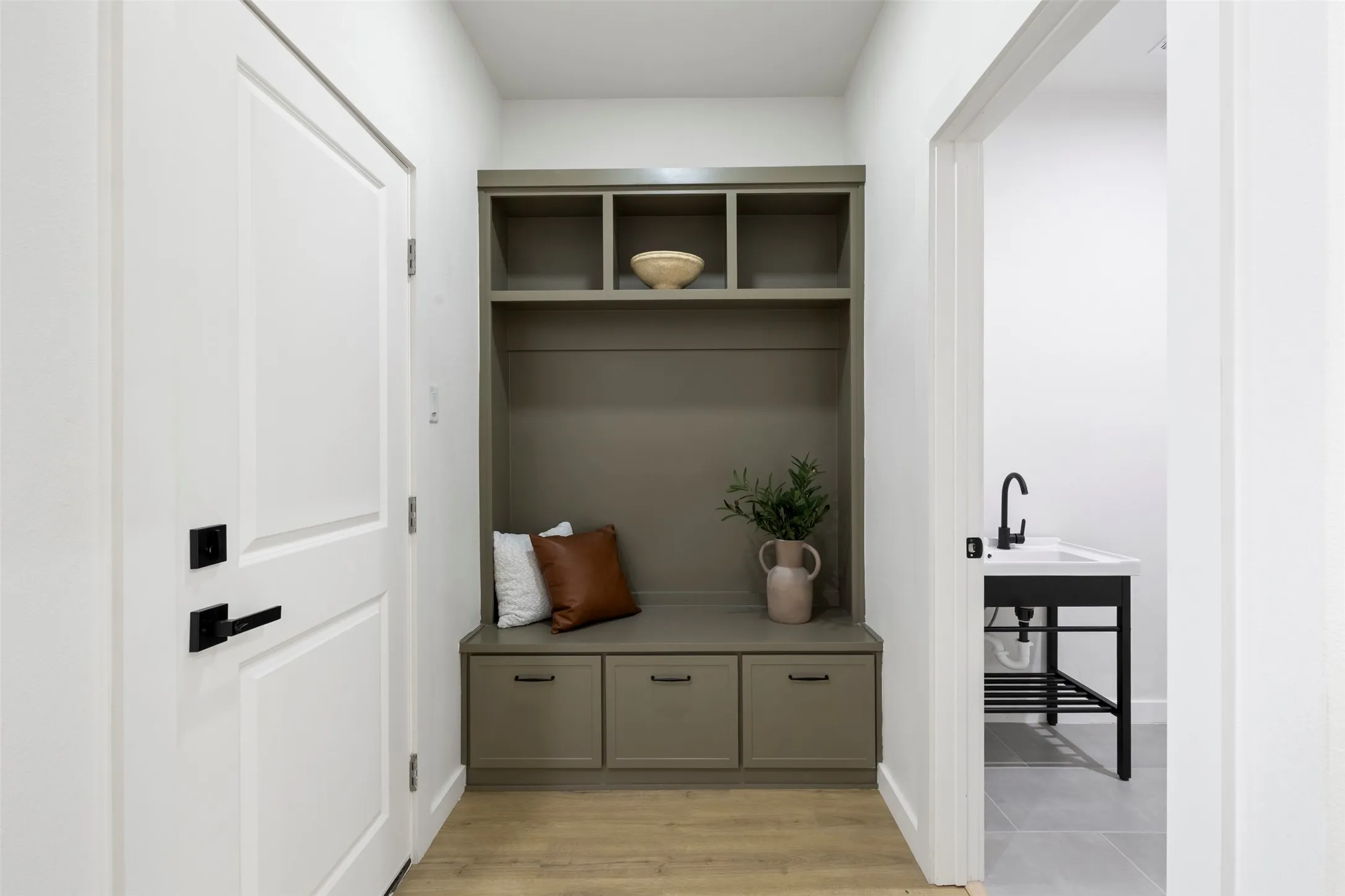 Built-in storage bench with cabinet and open shelving