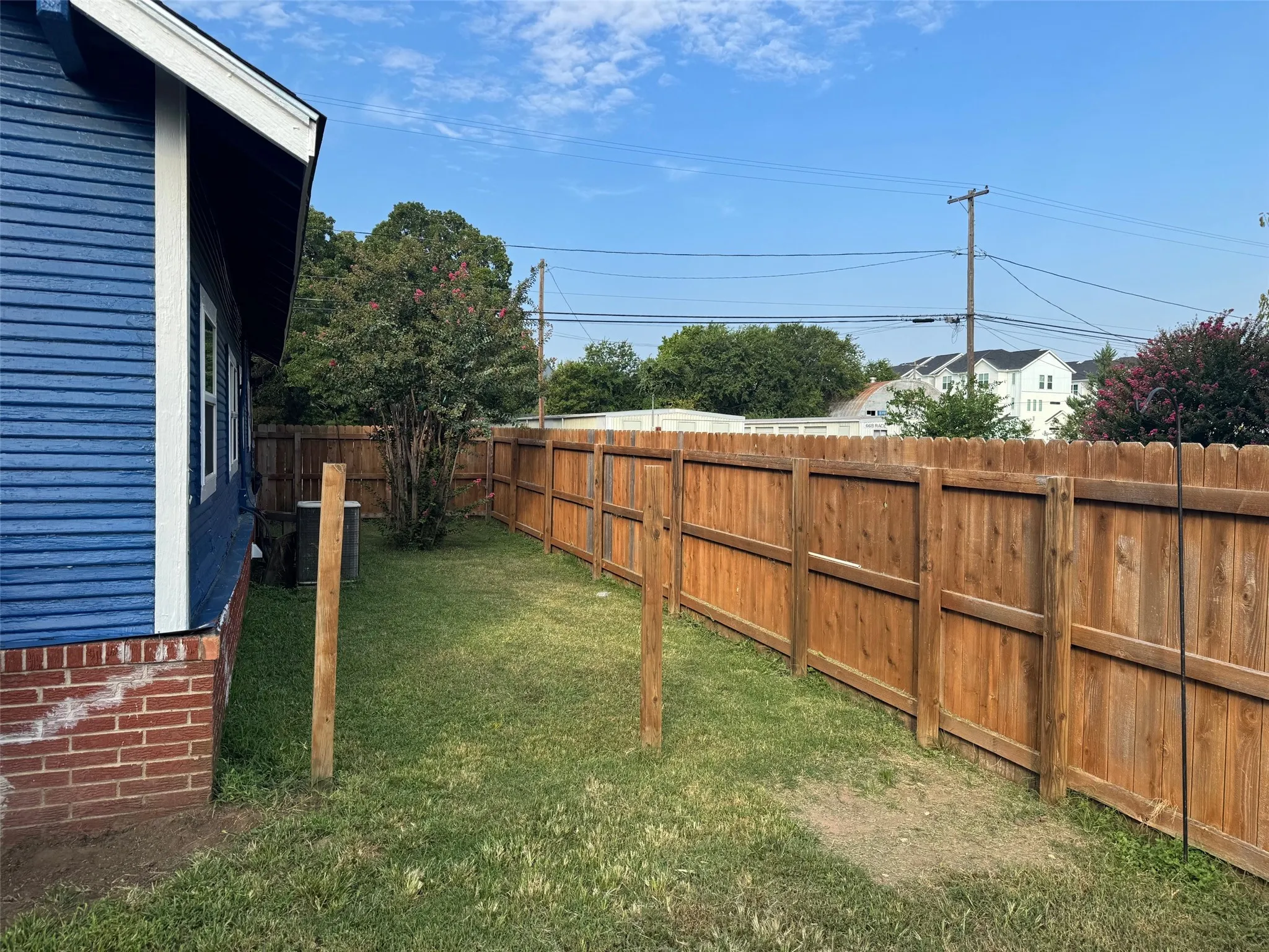 View of fenced backyard