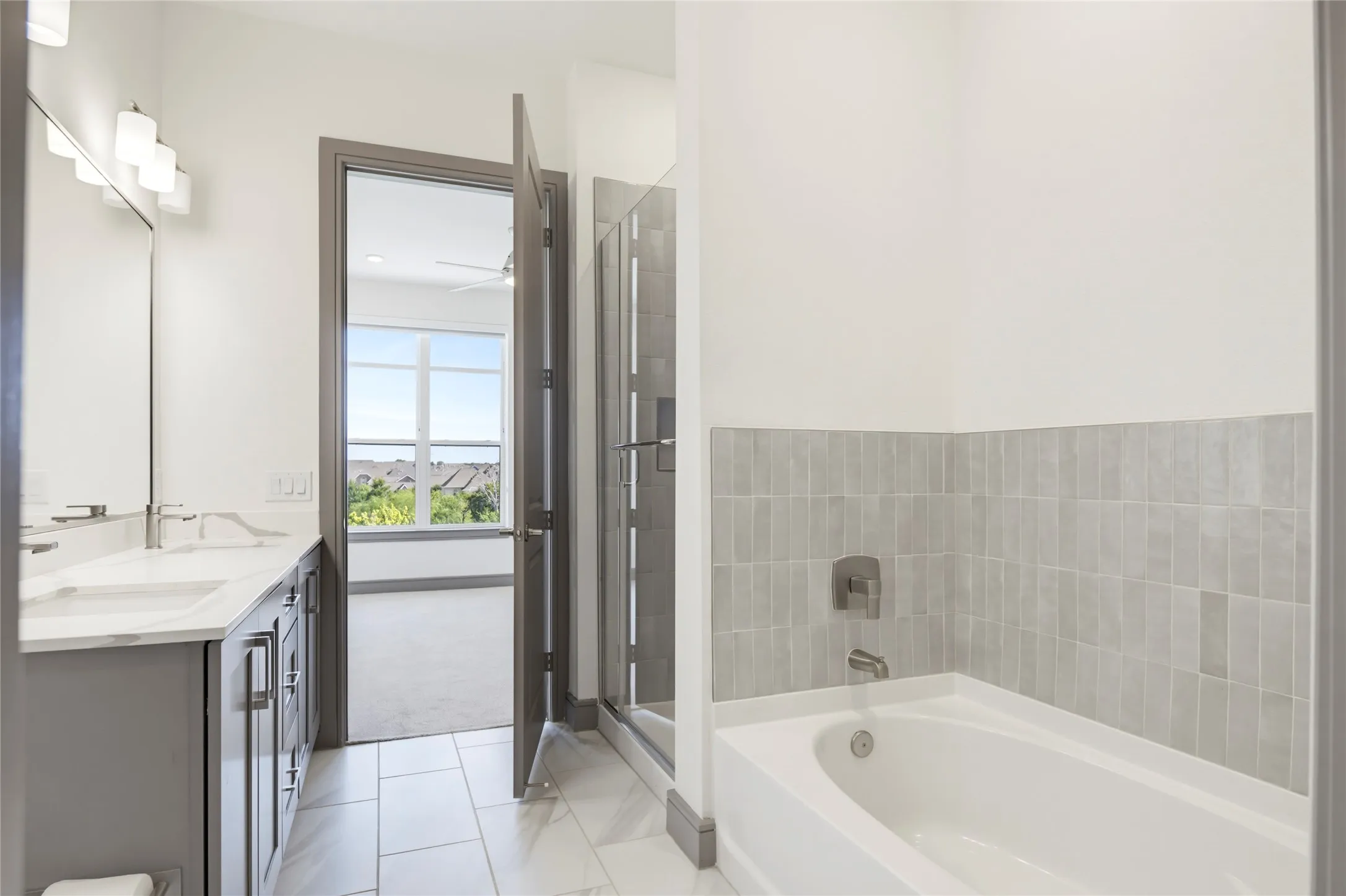 Dual vanity with undermount sinks and light-toned countertops