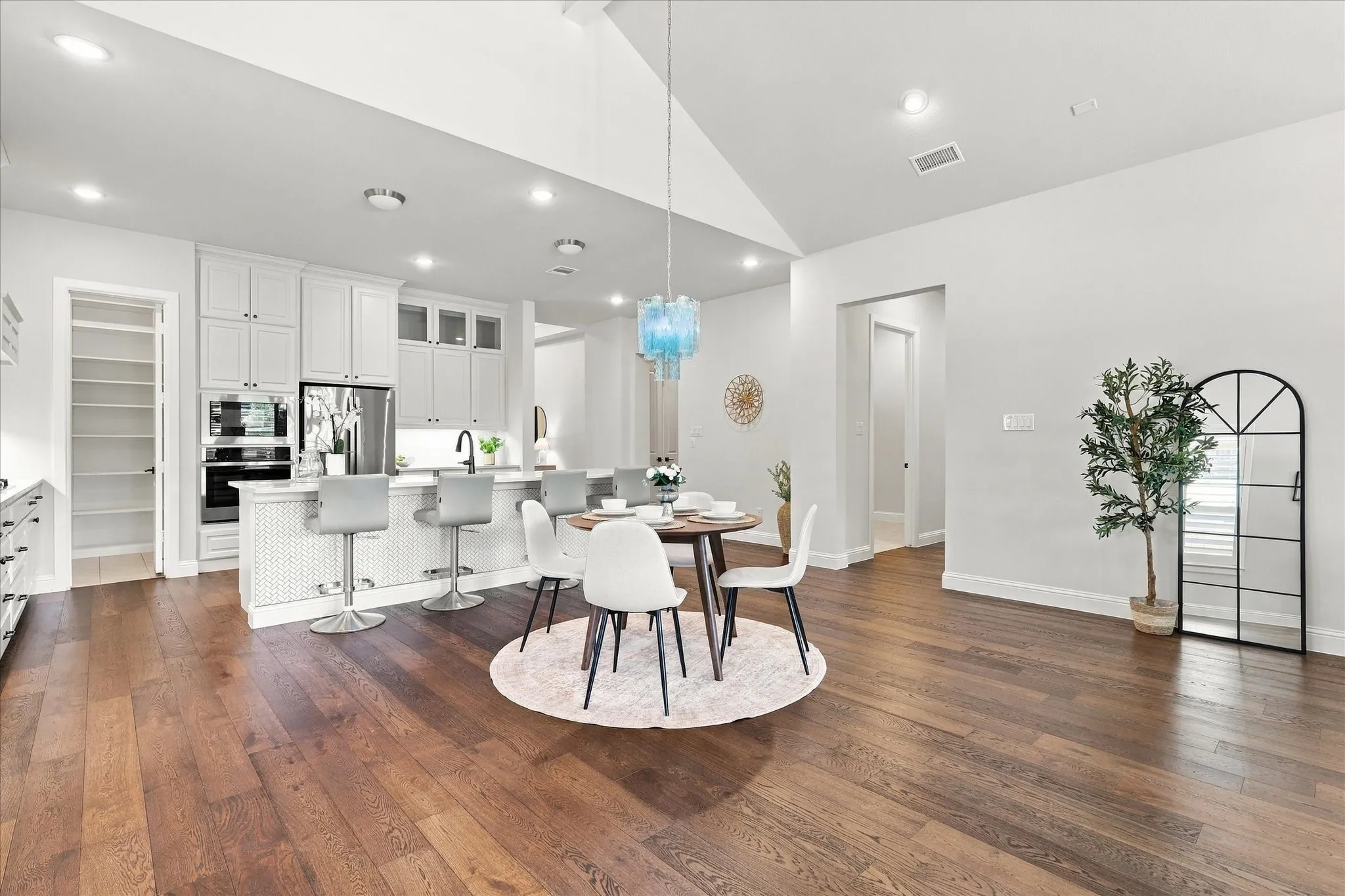 The house's floor plan is exceptional.  The hallway to the right leads to the Laundry room, guest bedroom and primary suite.