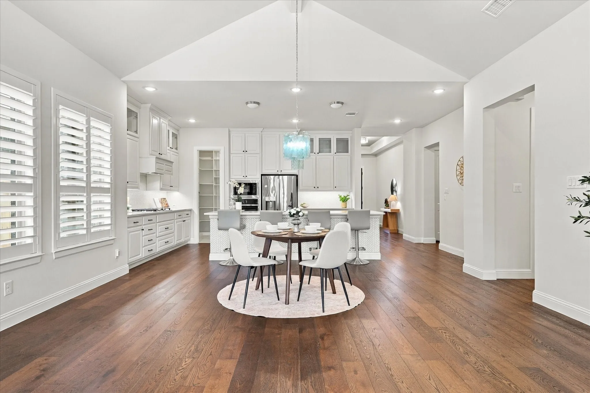 Note the architectural symmetry and interest within this space.  Modern shutters are the perfect window covering to control privacy and light.