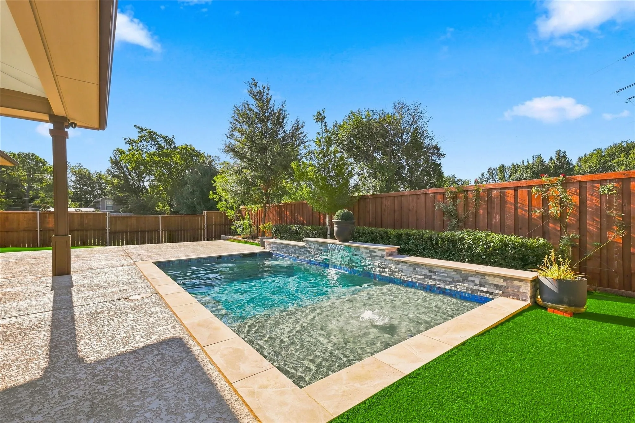 The turf within the entire fenced backyard is artificial!  No mowing, no watering, practically no bugs!