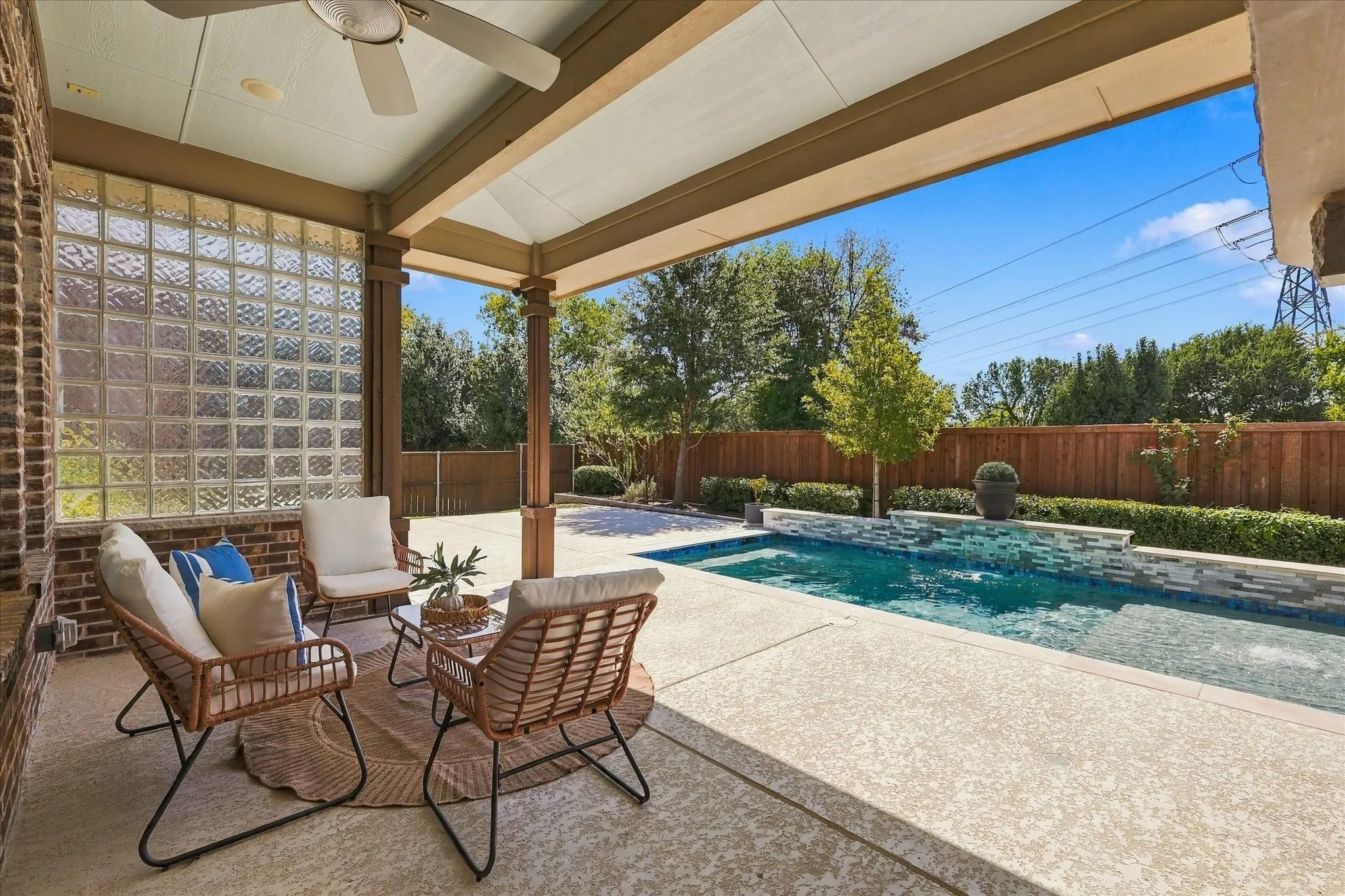 Isn't this amazing? An extended patio with open and covered areas overlooking a gorgeous pool.