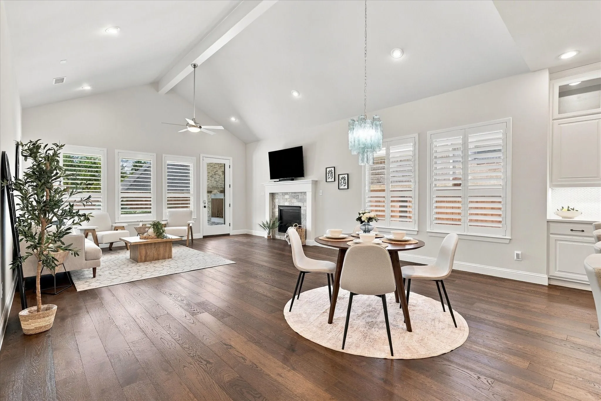 This large open plan can accommodate a variety of furniture arrangements.   Having the same flooring throughout allows one space to flow into another.