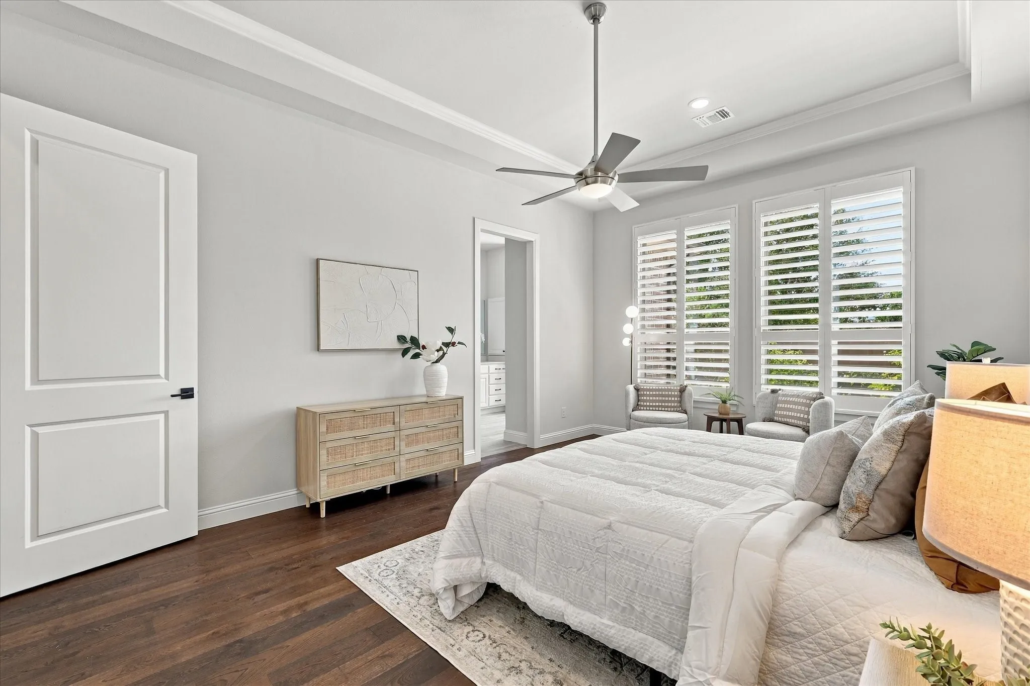 Primary bedroom with primary bath beyond.  An amazing closet is accessed within the bathroom.