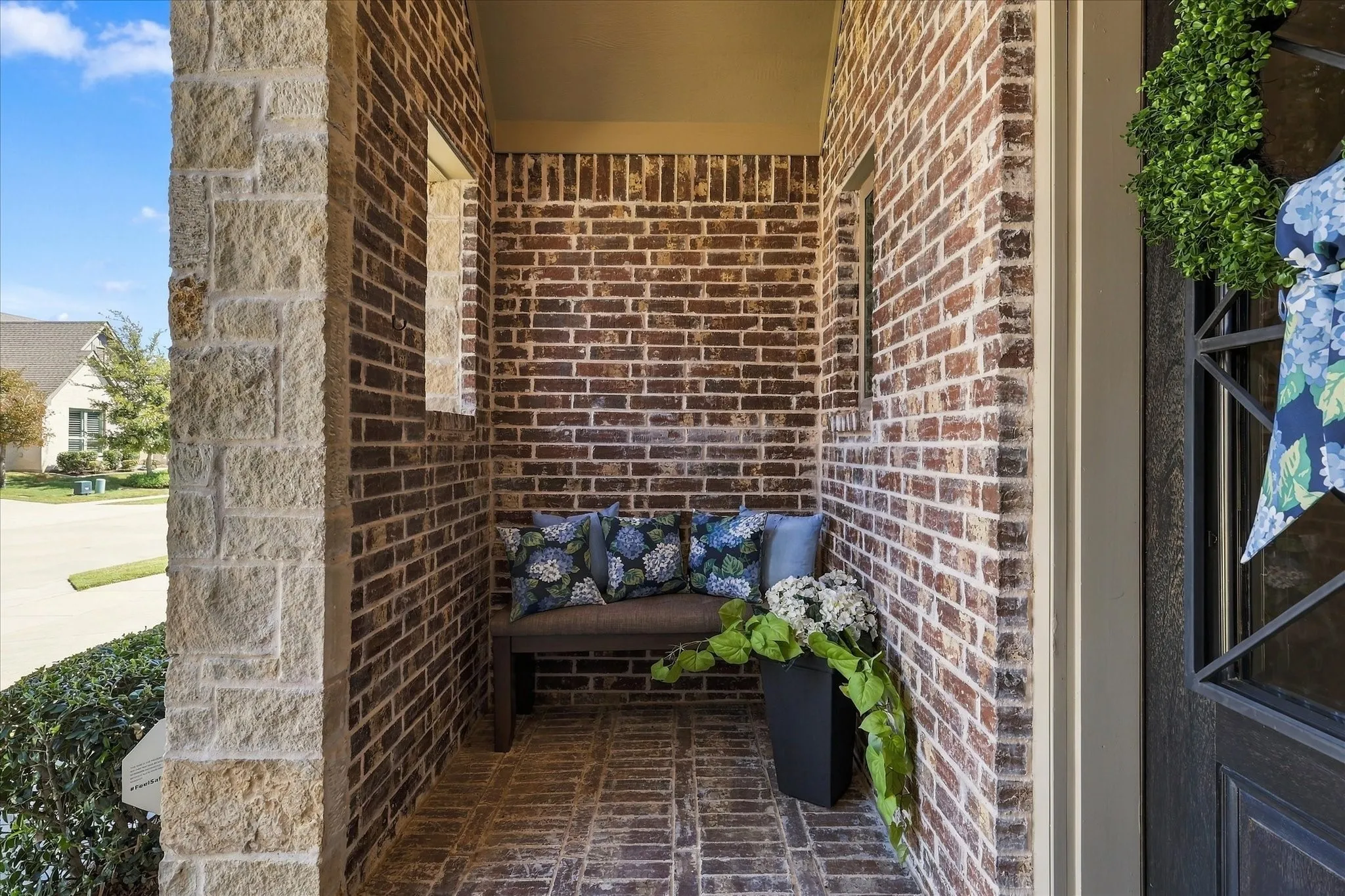 Protected from the weather, this covered patio is such a nice place to wait for a friend!