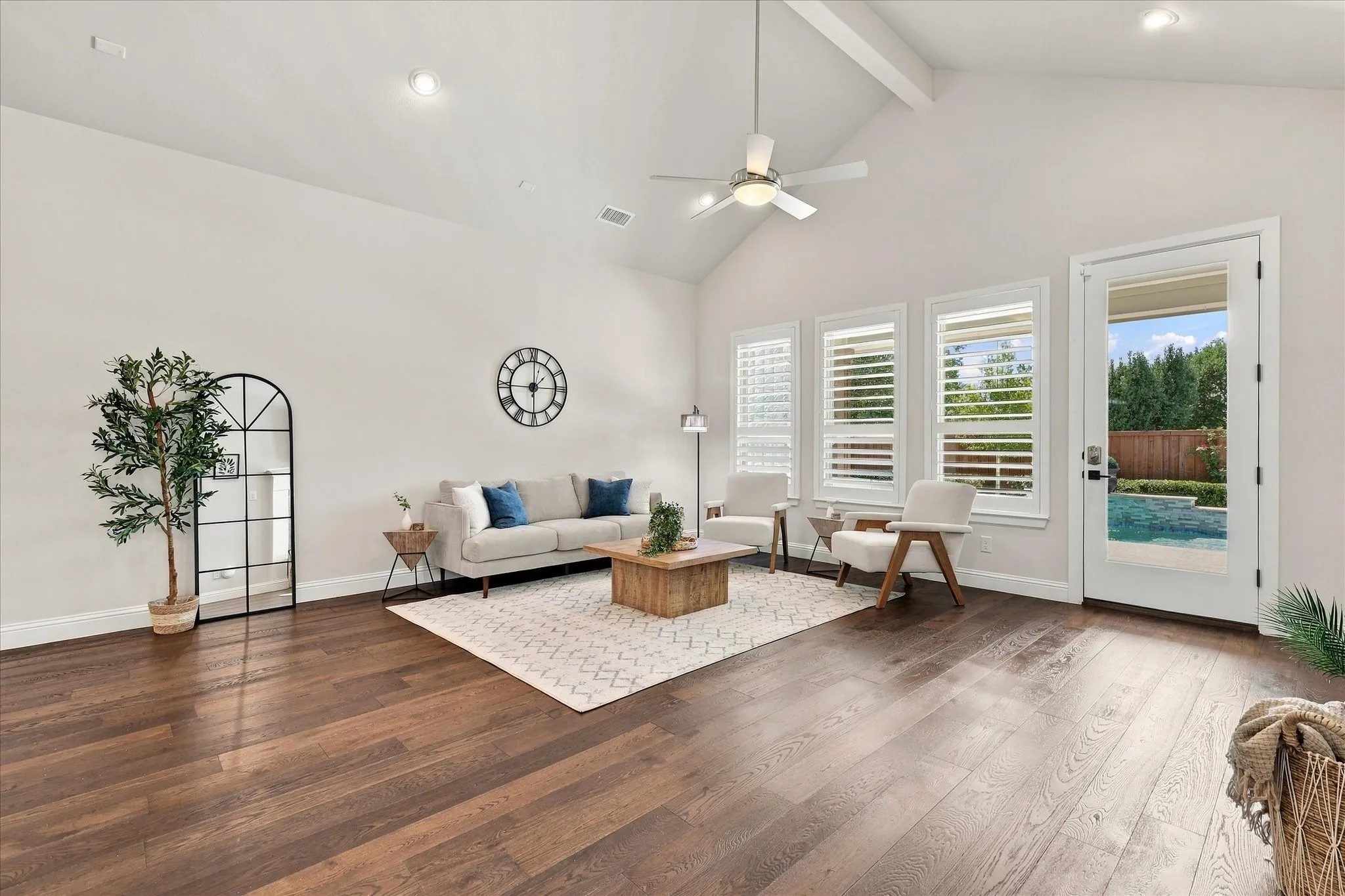 Wonderful southern views of the patio and pool from the living room.