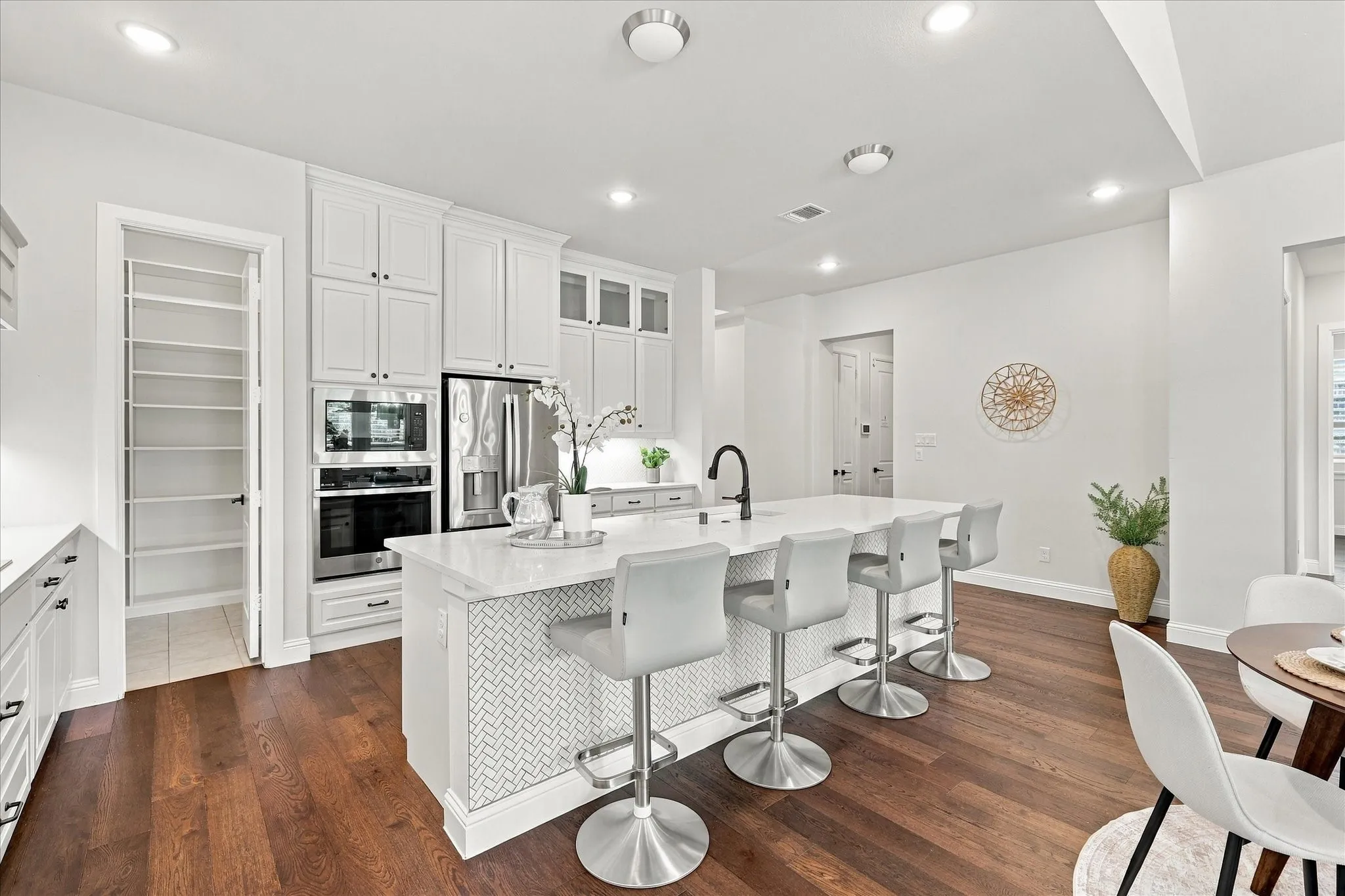 Note the herringbone ceramic tile beneath the bar.  Such a practical and beautiful feature!