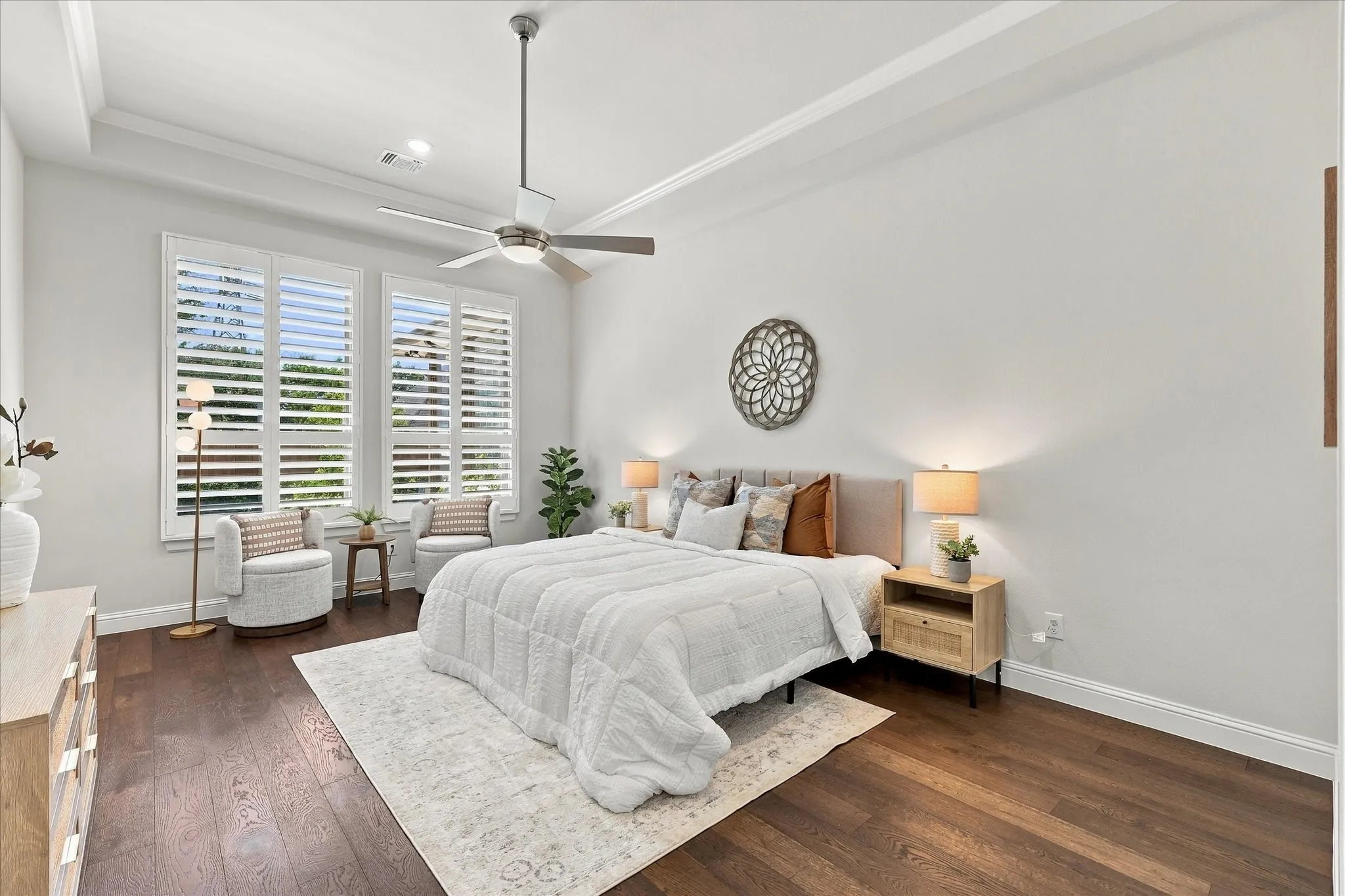 At 18 x 13, this spacious primary bedroom has room for a king-sized bed and sitting area.  The tray ceiling adds an important architectural detail.