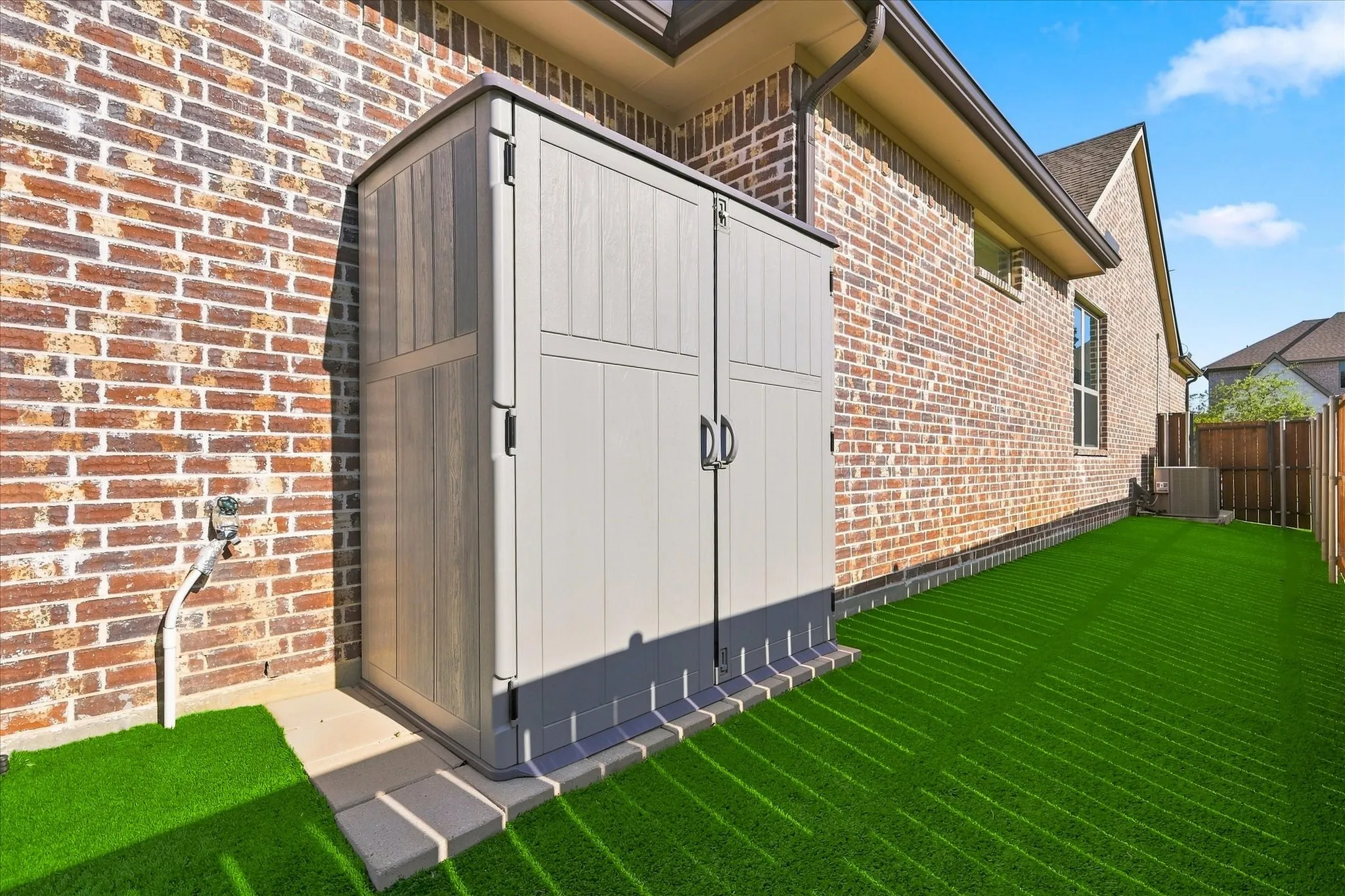 Even the storage shed was designed with beauty and function in mind!    Have you ever seen such a nice side yard?