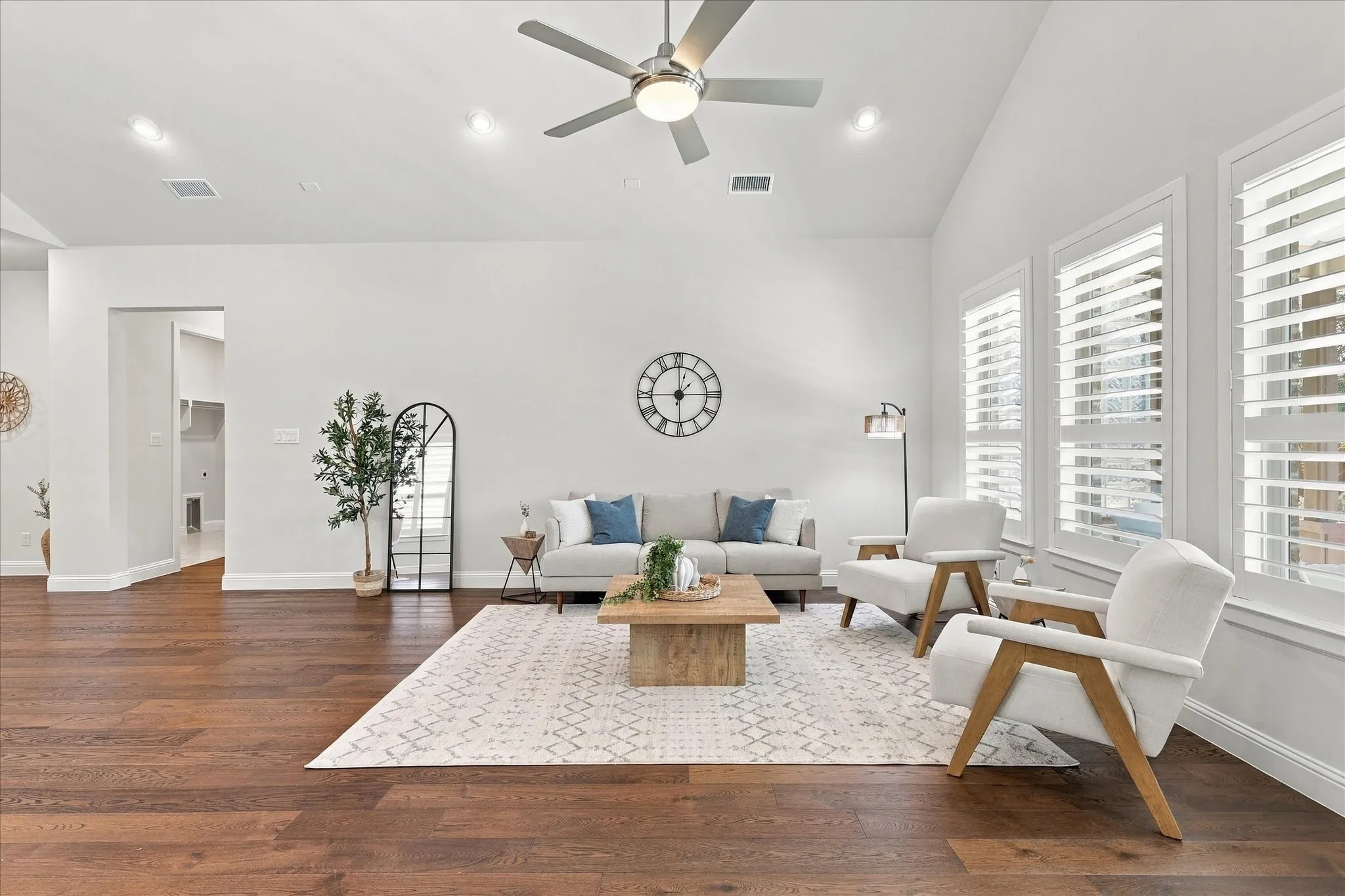 Alcove to laundry, secondary bedroom, and primary suite to the left
