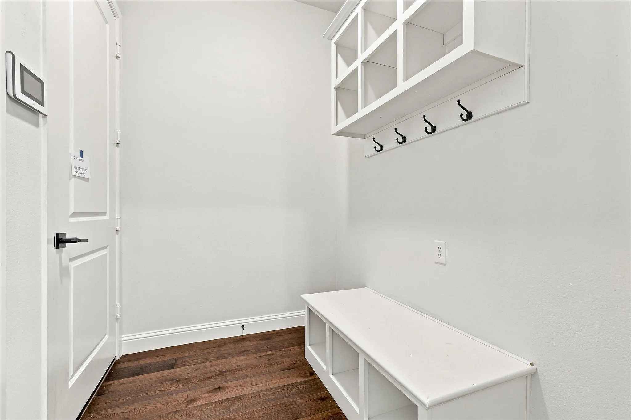 Garage entry drop-off point for coats, shoes, bags
