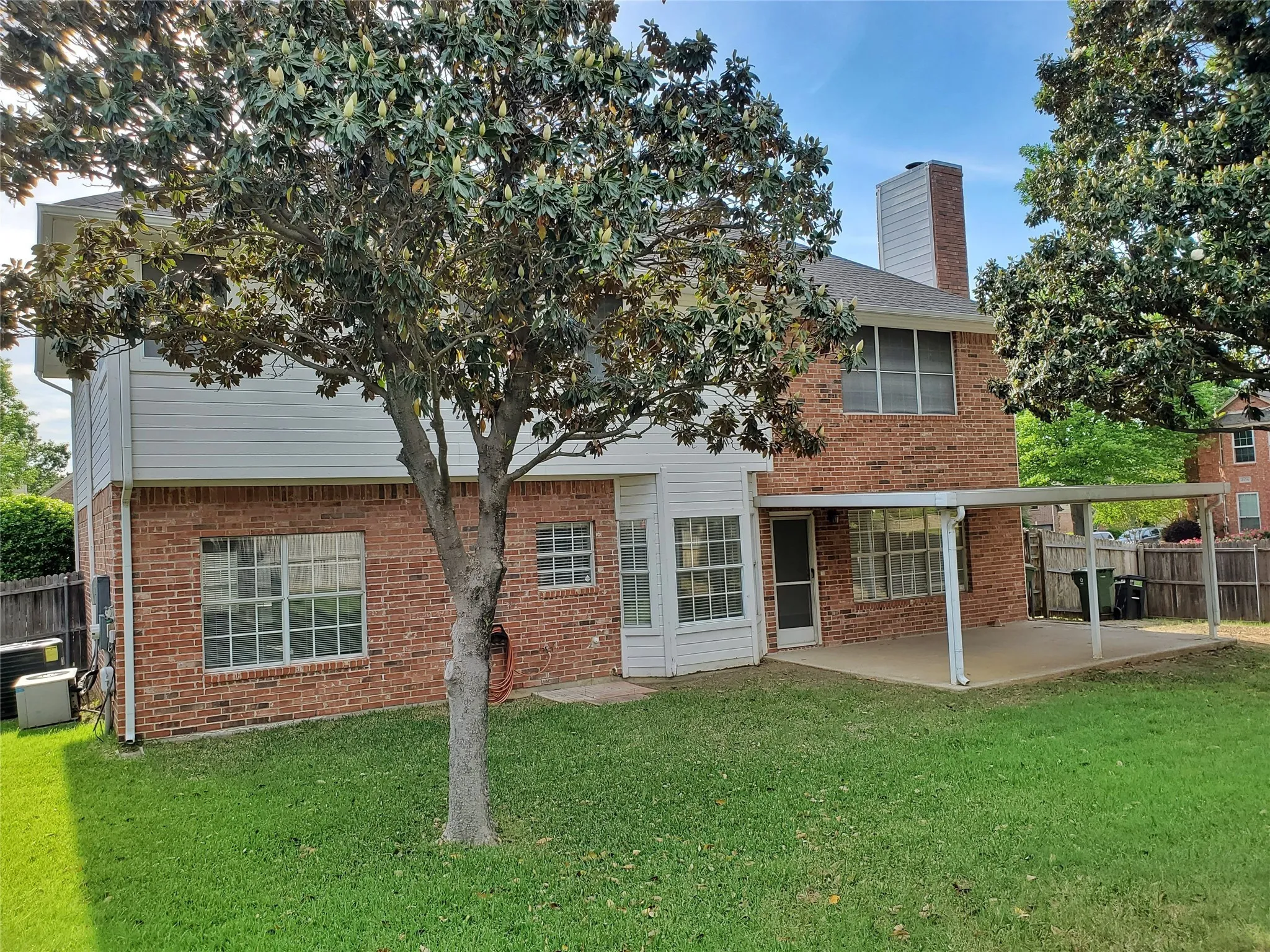 Home has a large yard, on a corner lot with mature trees.