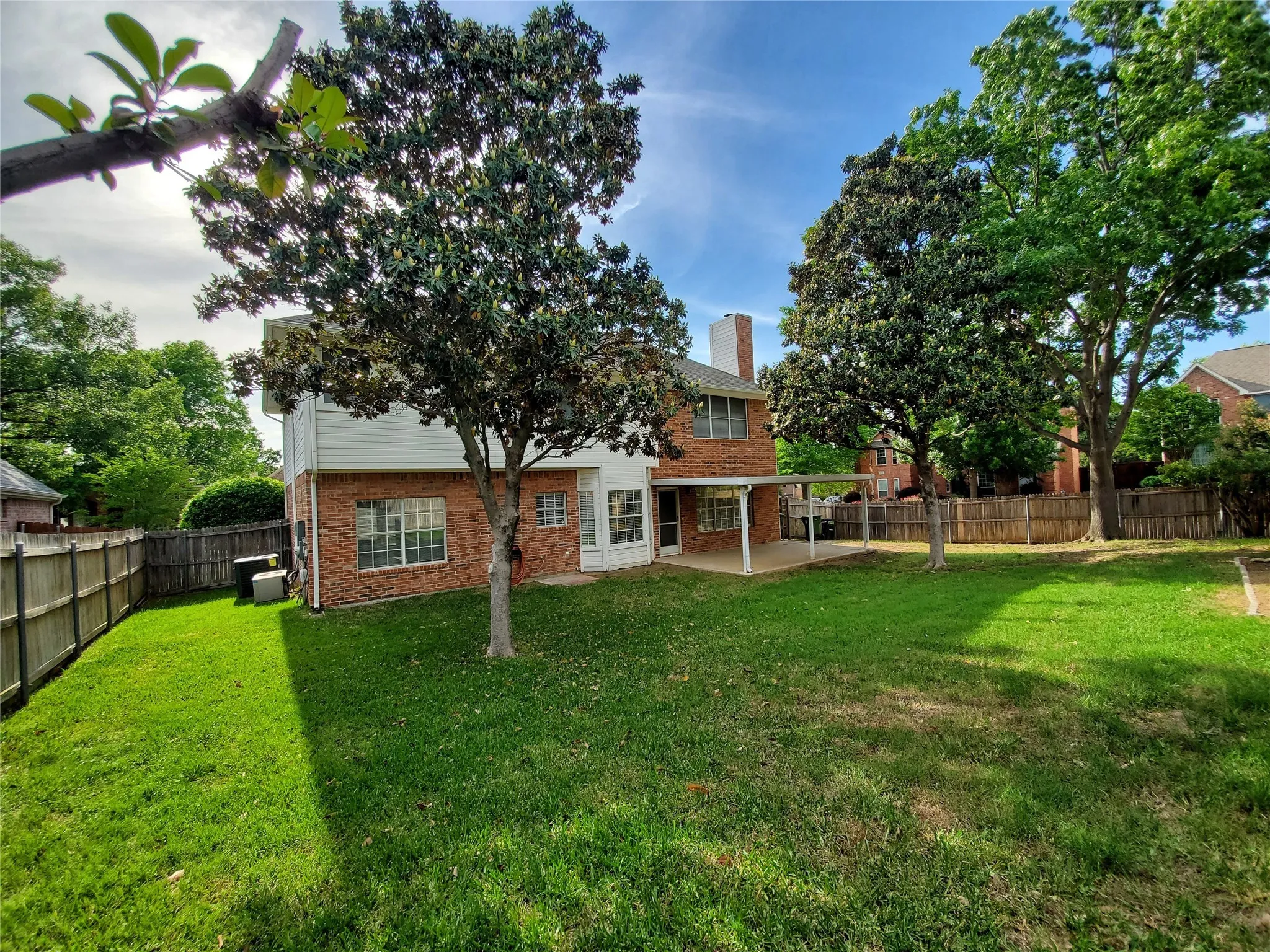 Mature shade trees, and another view of back porch.