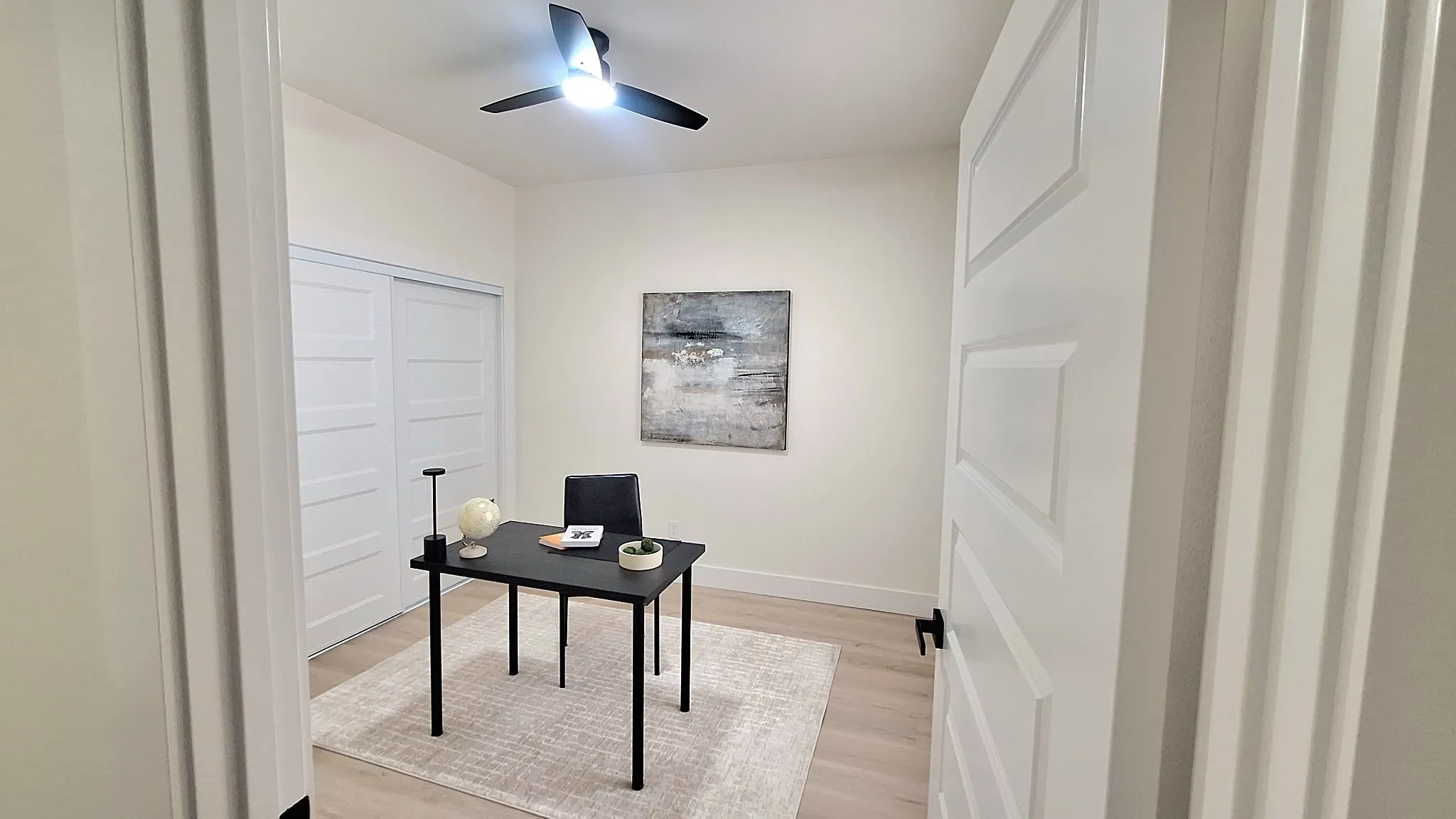 Recessed lighting, wood-finish flooring, sliding closet doors, and a ceiling fan with integrated lighting