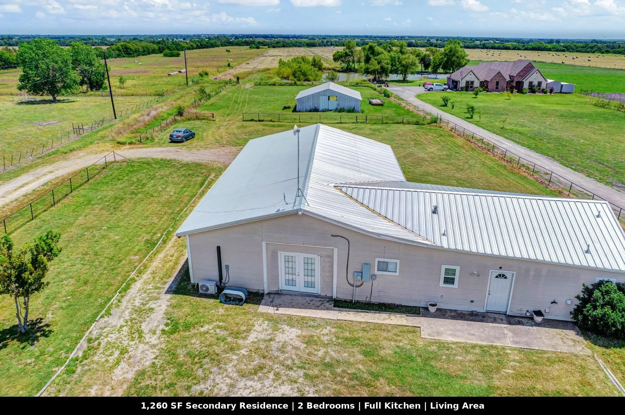 Modern secondary residence featuring 1,260 SF of living space with 2 bedrooms, full kitchen, and dedicated living area