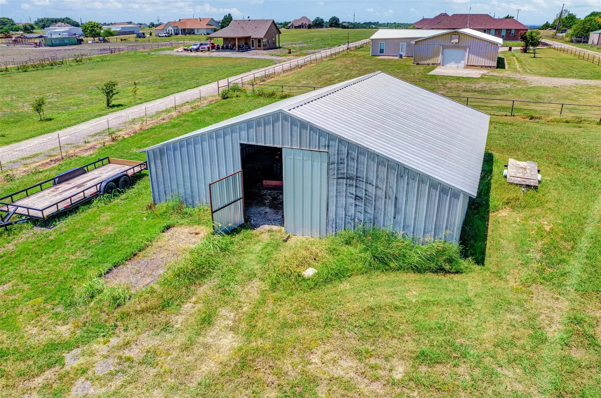 Metal-clad outbuilding with a corrugated metal roof