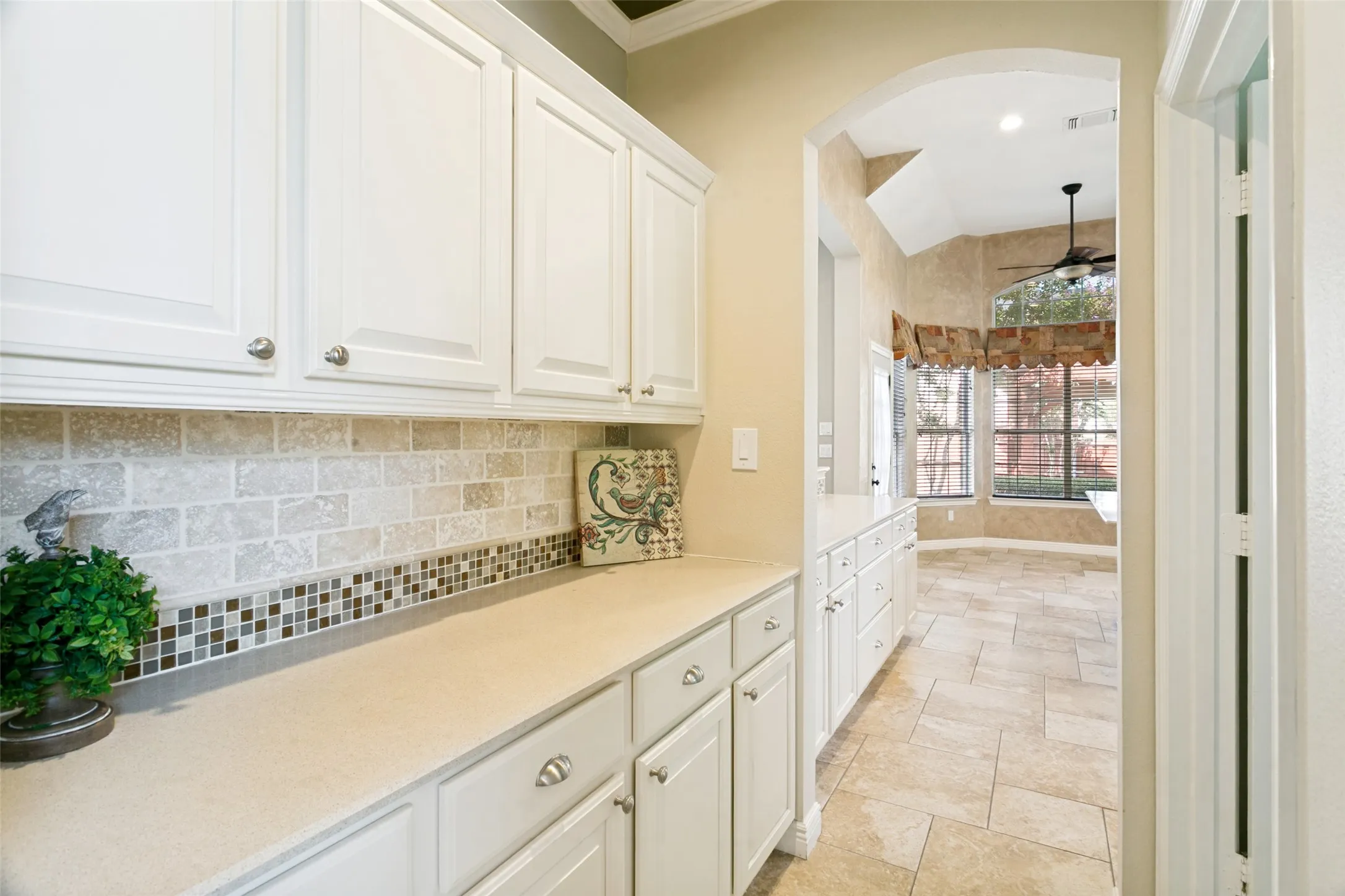 Butler's pantry between kitchen and dining room