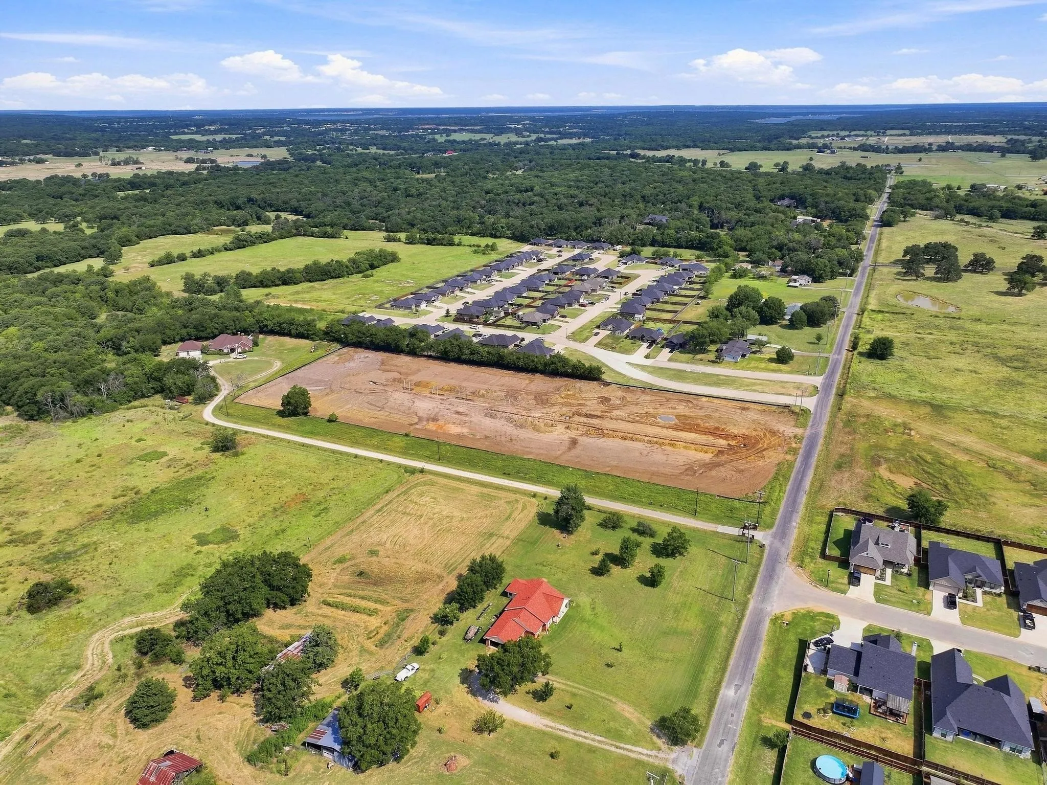 Expansive undeveloped land parcel with direct road frontage