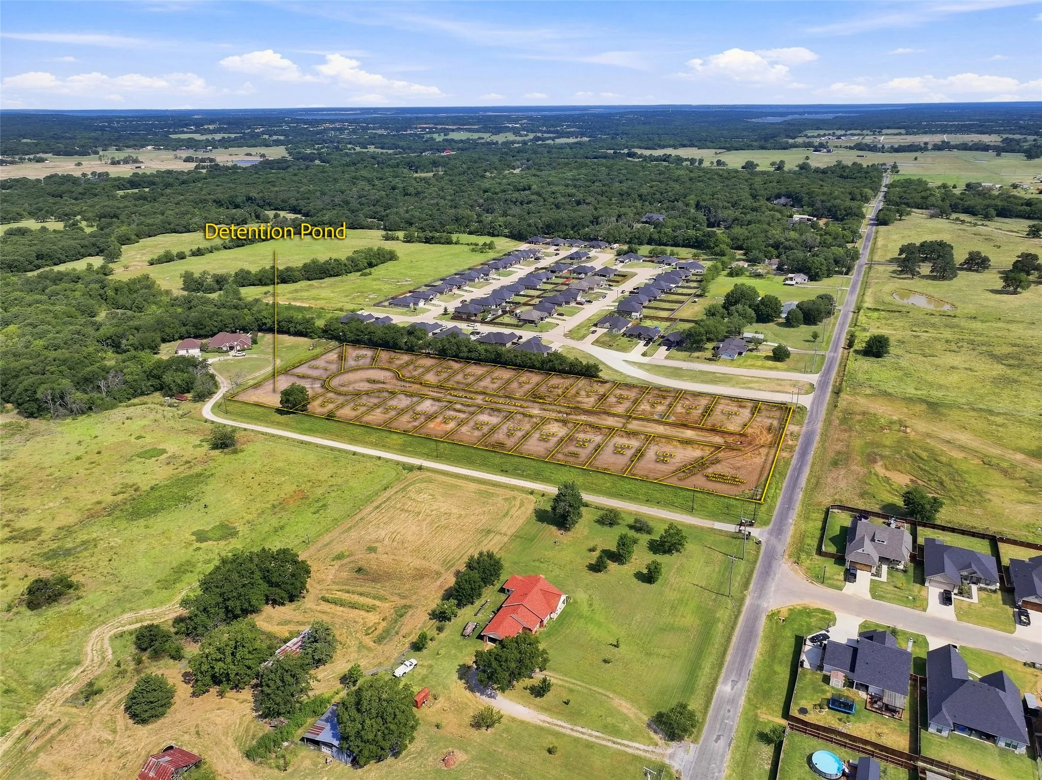 Subdivision development with delineated lots and established roadways