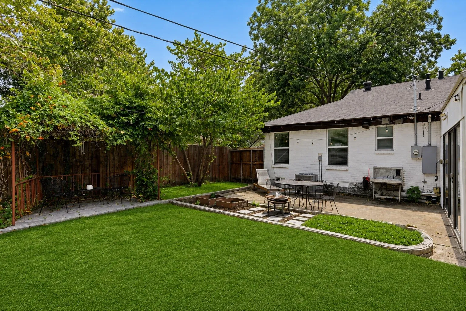 Expansive backyard with great patio. Grass has been digitally enhanced to be greener.