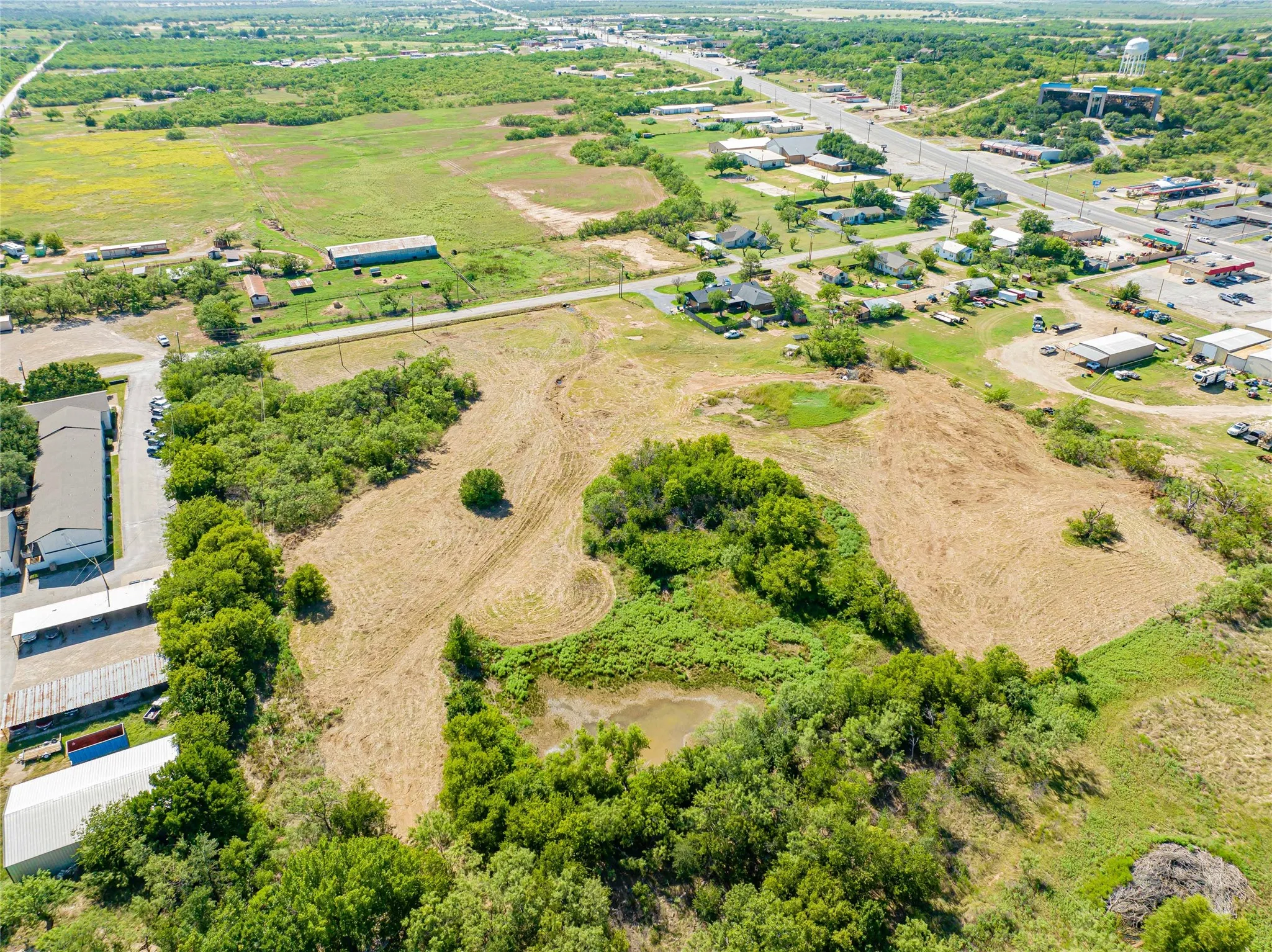 Expansive land parcel featuring natural vegetation and cleared areas