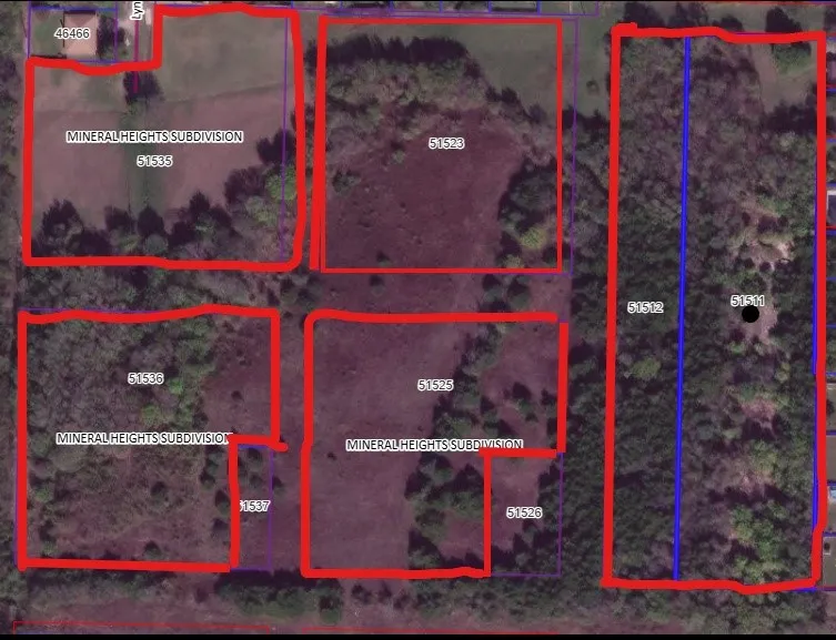Aerial Property Survey. Cadastral mapping displaying multiple parceled land divisions with boundary demarcations and parcel identification numbers