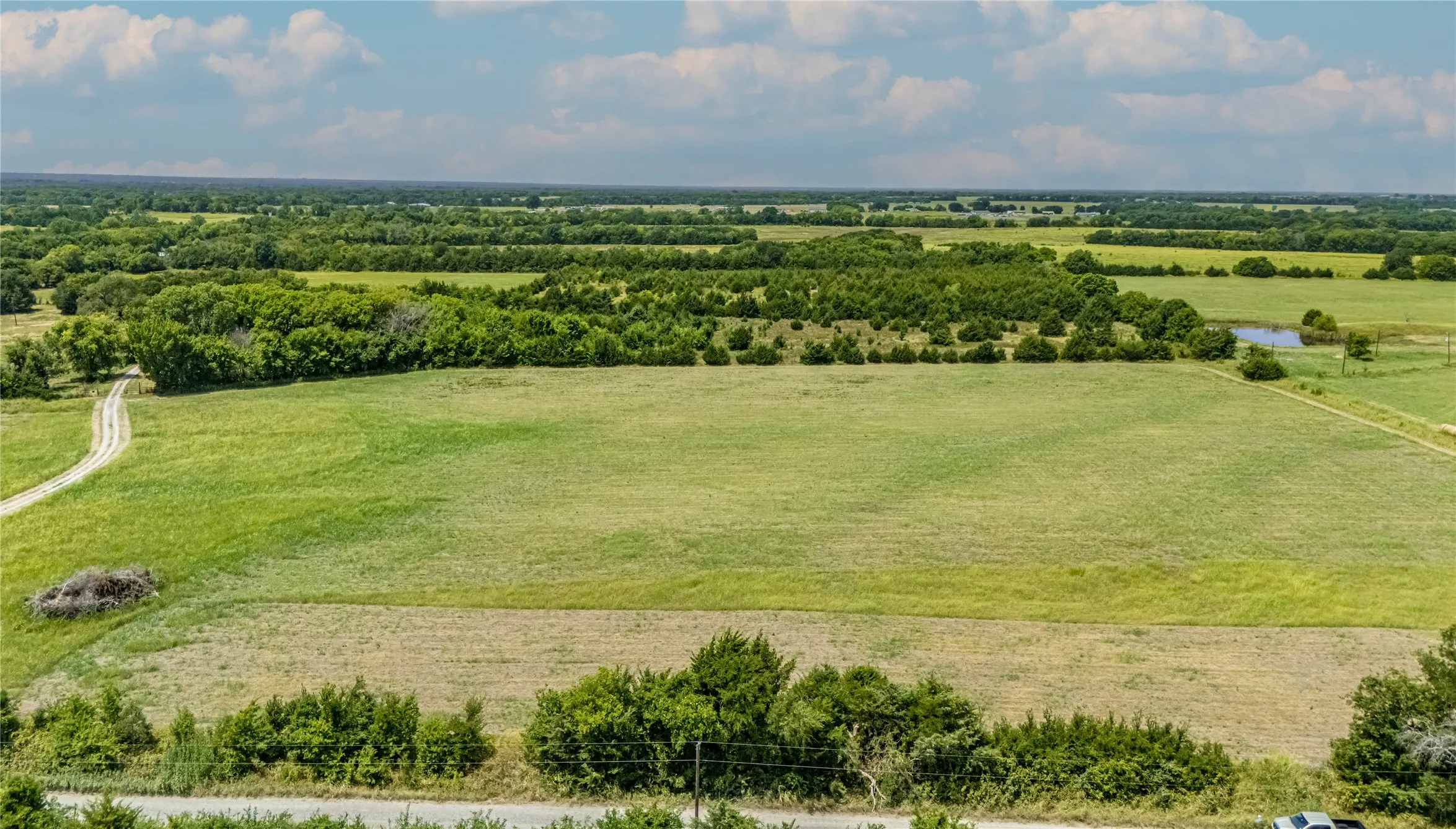 Expansive green fields that have a hay Ag Exemption and 2 water meters
