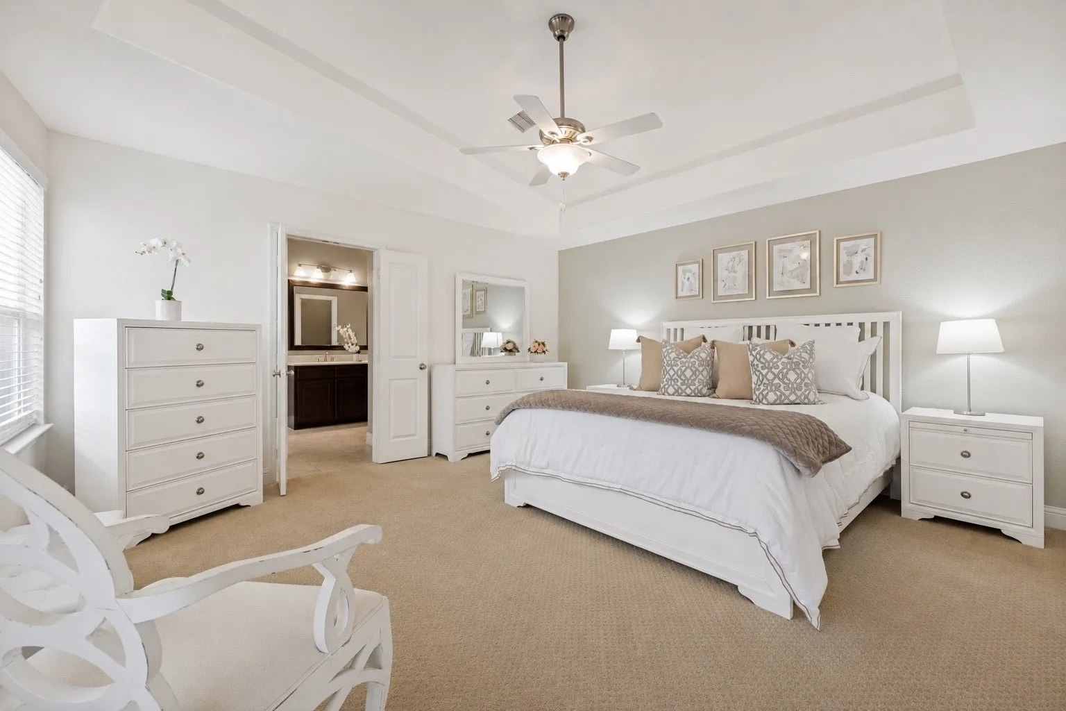 Spacious primary suite with abundant natural light.