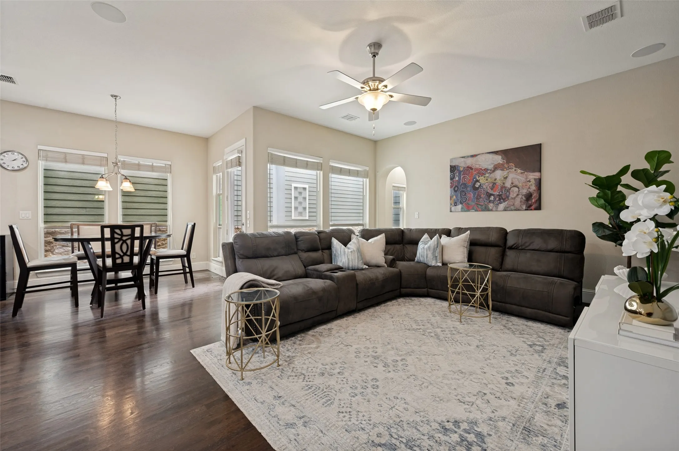 Light-filled living room with hardwood floors.